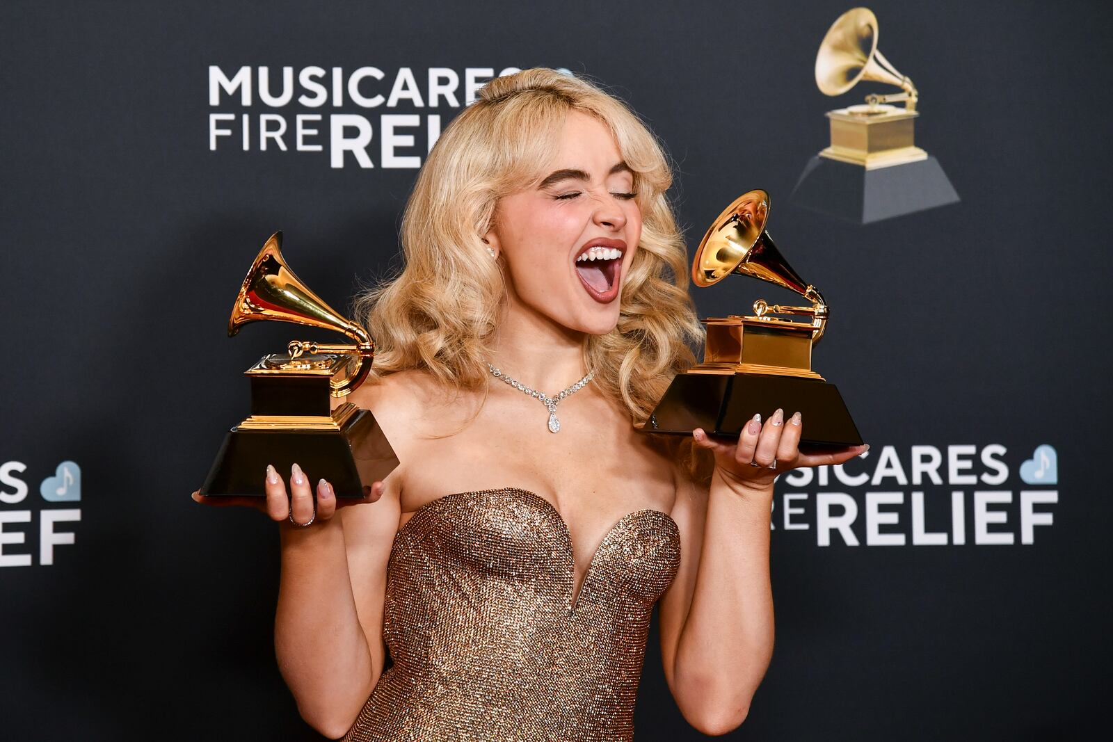 Sabrina Carpenter poses in the press room with the award for best pop solo performance, and best pop vocal album during the 67th annual Grammy Awards on Sunday, Feb. 2, 2025, in Los Angeles. (Photo by Richard Shotwell/Invision/AP)