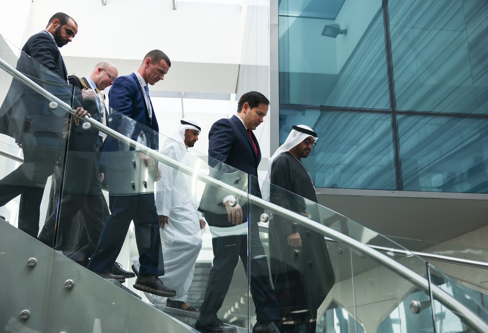 U.S. Secretary of State Marco Rubio, center, walks with United Arab Emirates President Sheikh Mohamed bin Zayed Al Nahyan, right, as they meet at ADNEC Centre Abu Dhabi in Abu Dhabi, United Arab Emirates, Wednesday, Feb. 19, 2025. (Evelyn Hockstein/Pool Photo via AP)