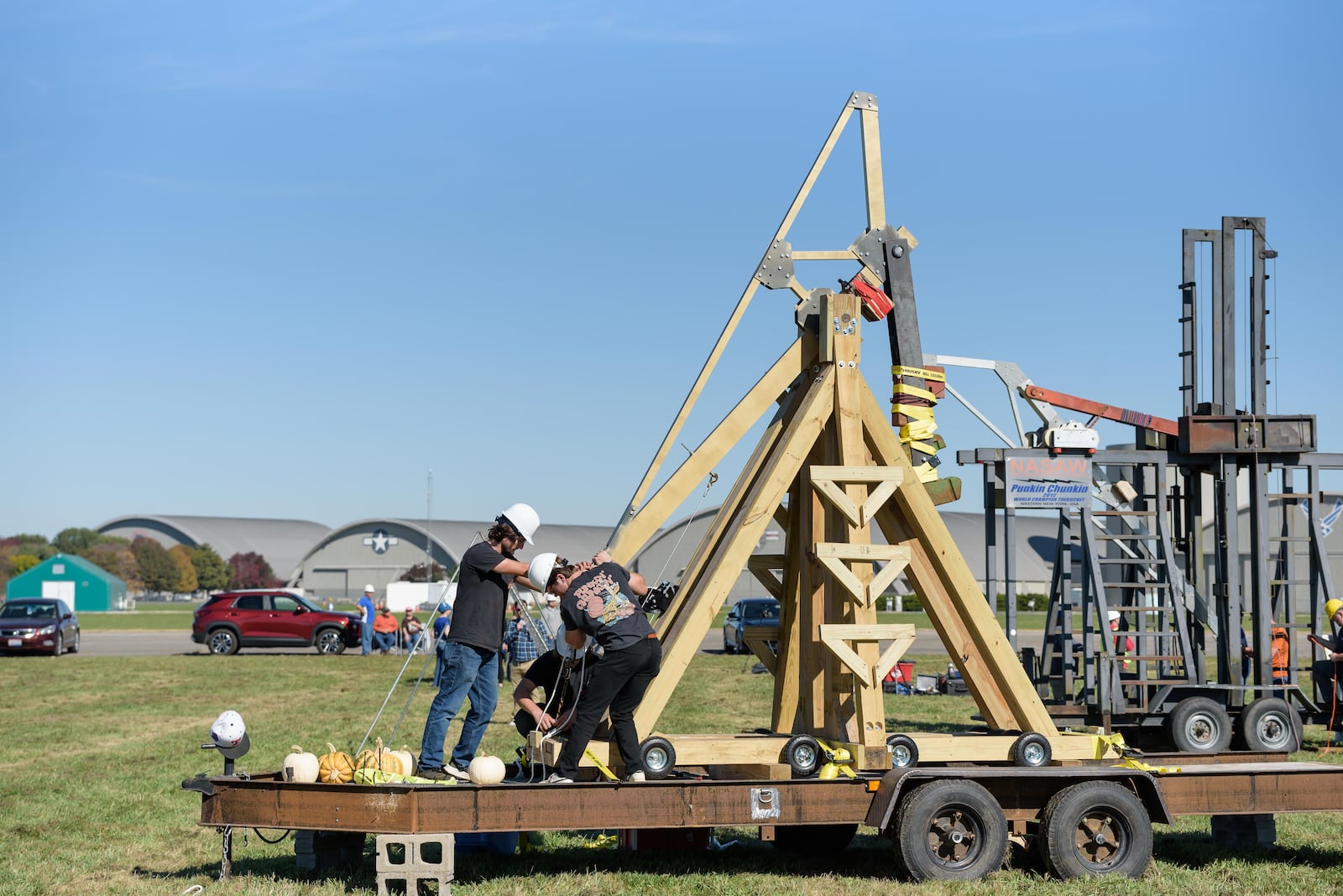 The 20th annual Wright-Patterson Air Force Base Pumpkin Chuck happened on the grounds of the National Museum of the U.S. Air Force on Saturday, Oct. 19, 2024. Hosted by the Air Force Life Cycle Management Center’s Engineering Directorate, the event is a Science, Technology, Engineering and Math (STEM) competition involving pumpkin-flinging machines launching pumpkins that weigh 8 to 10 pounds (Class A) and two-pound orange squashes (Class B). Teams that didn’t choose to build their own machines also signed up onsite to compete on a novice level with human-powered machines (Class C). TOM GILLIAM/CONTRIBUTING PHOTOGRAPHER