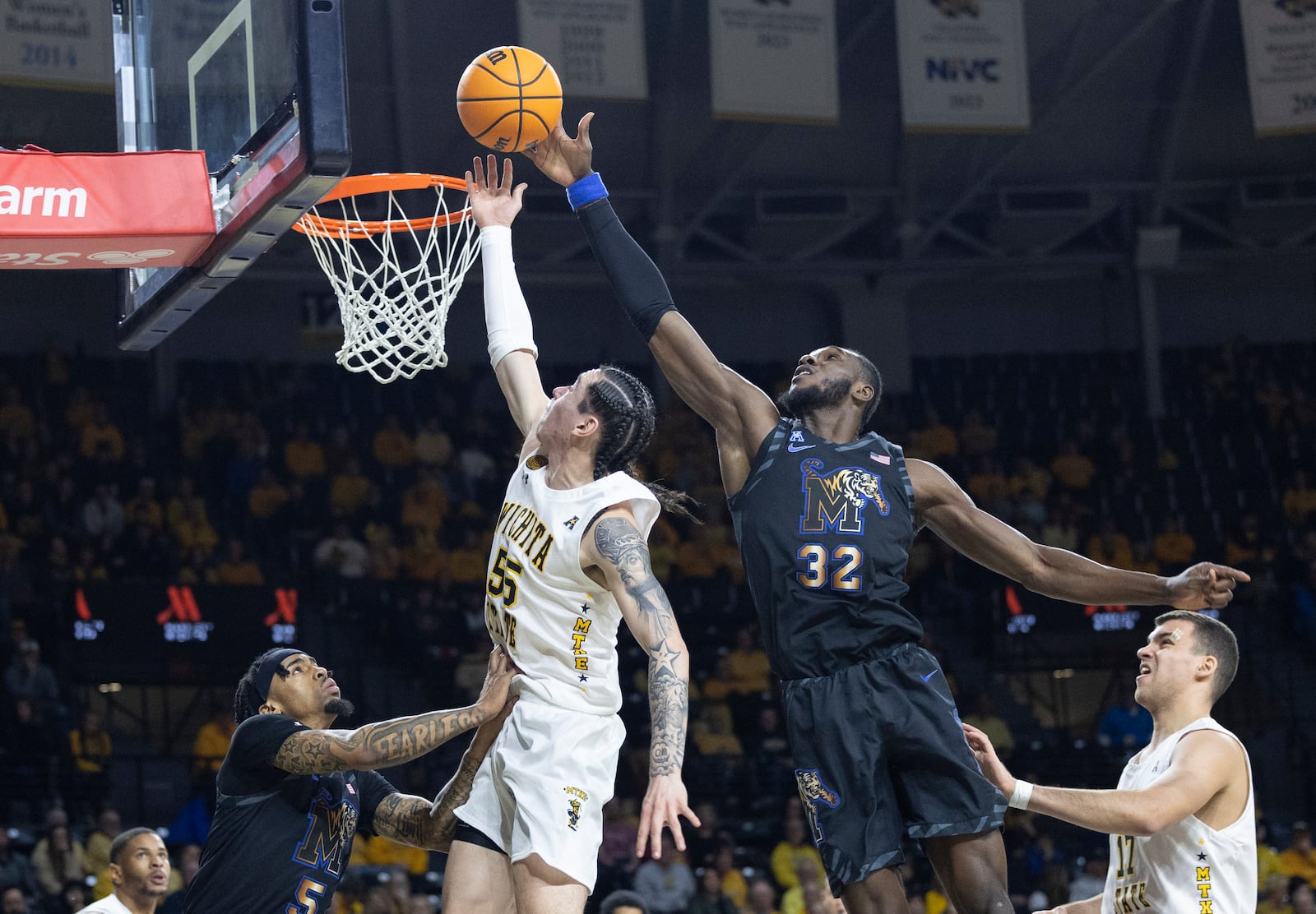 Memphis' Moussa Cisse (32) blocks the shot of Wichita State's Bijan Cortes during the first half of an NCAA college basketball game, Sunday, Feb. 16, 2025, in Wichita, Kan. (AP Photo/Travis Heying)