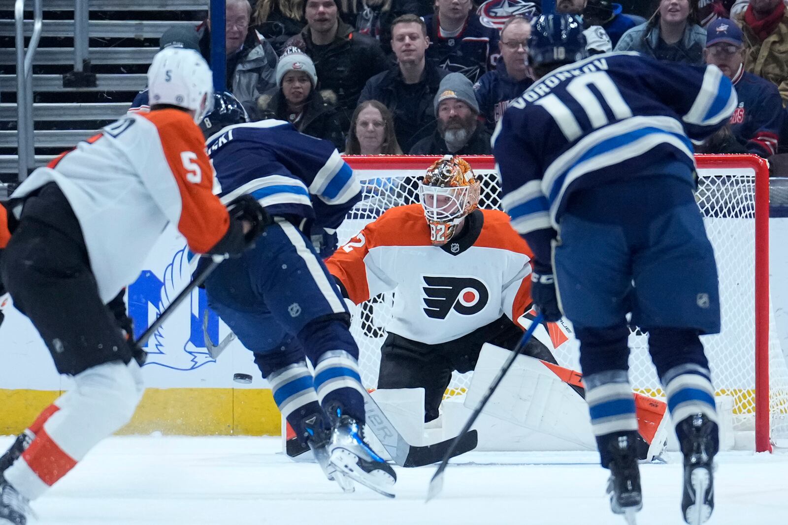 Columbus Blue Jackets defenseman Zach Werenski, second from left, scores on Philadelphia Flyers goaltender Ivan Fedotov in the first period of an NHL hockey game Tuesday, Jan. 14, 2025, in Columbus, Ohio. (AP Photo/Sue Ogrocki)