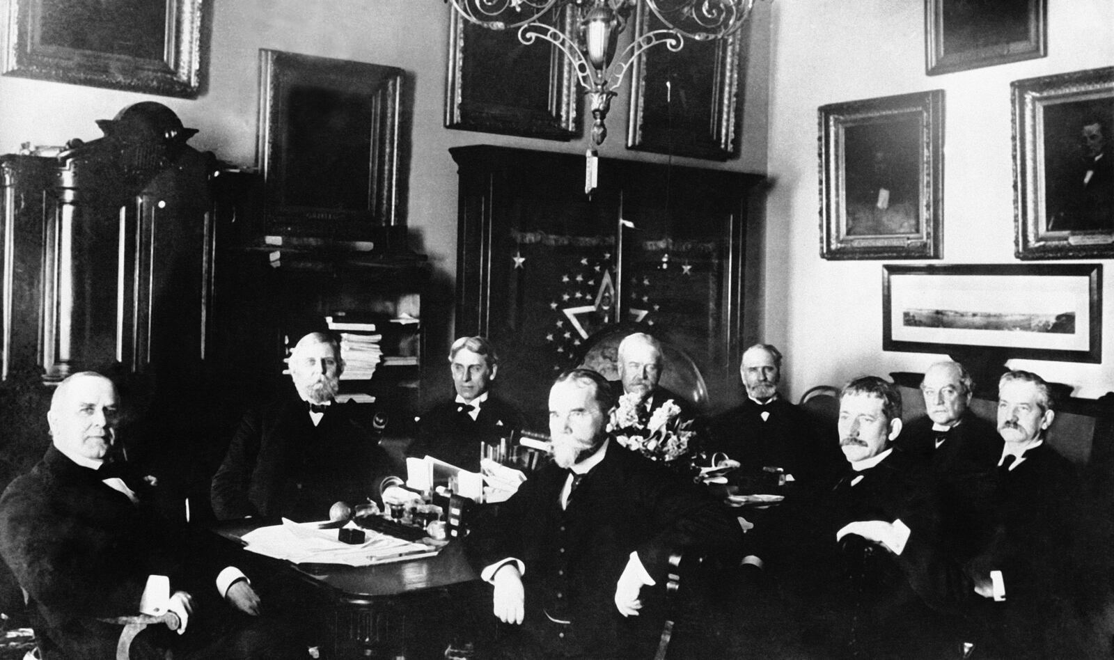 U.S. President William Mckinley, left, sits with his cabinet during a meeting in the White House. Second from left, foreground, Secretary of State John Hay, third from left, Secretary of War Elihu Root. This photo is circa 1898. (AP Photo)