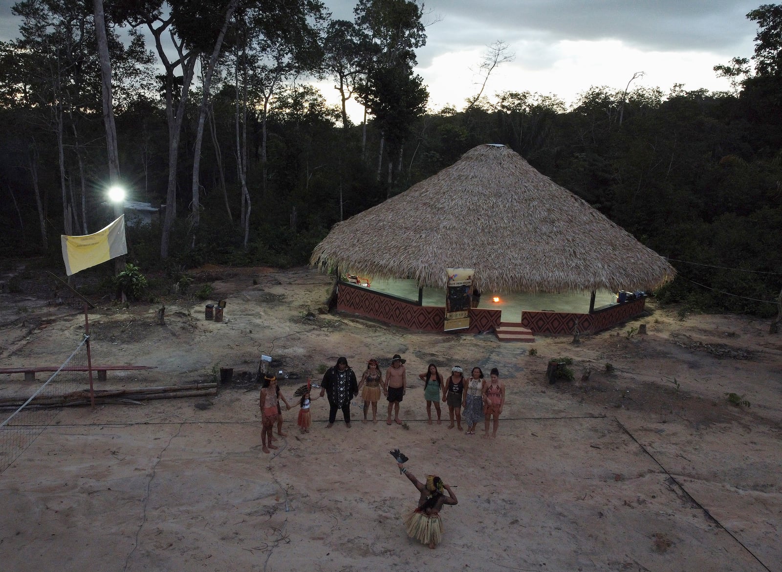 Members of the Indigenous ethnic group Kokama perform a ritual to send good energies to Brazilian actress Fernanda Torres, who's been nominated for a best actress Oscar for her role in the film "I'm Still Here," at the Inhaa-be village, Manaus, Amazonas state, Friday, Feb. 28, 2025. (AP Photo/Edmar Barros)