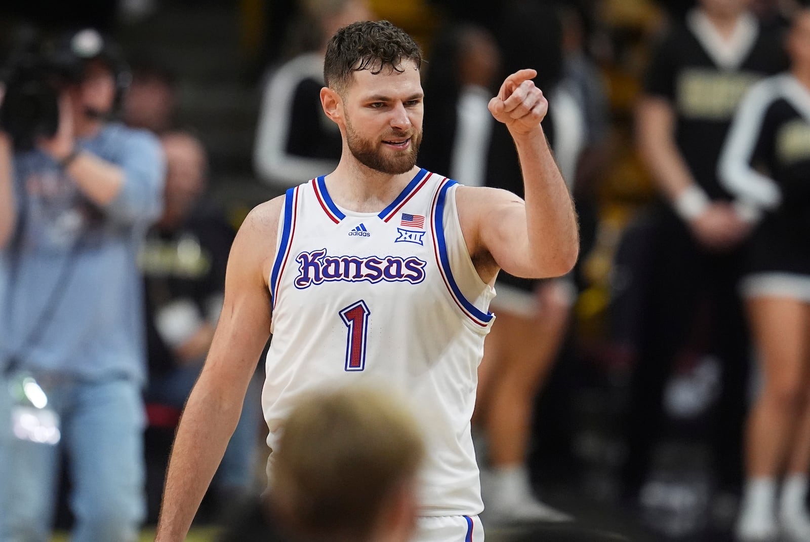 Kansas center Hunter Dickinson gestures after scoring a basket late in the second half of an NCAA college basketball game against Colorado, Monday, Feb. 24, 2025, in Boulder, Colo. (AP Photo/David Zalubowski)