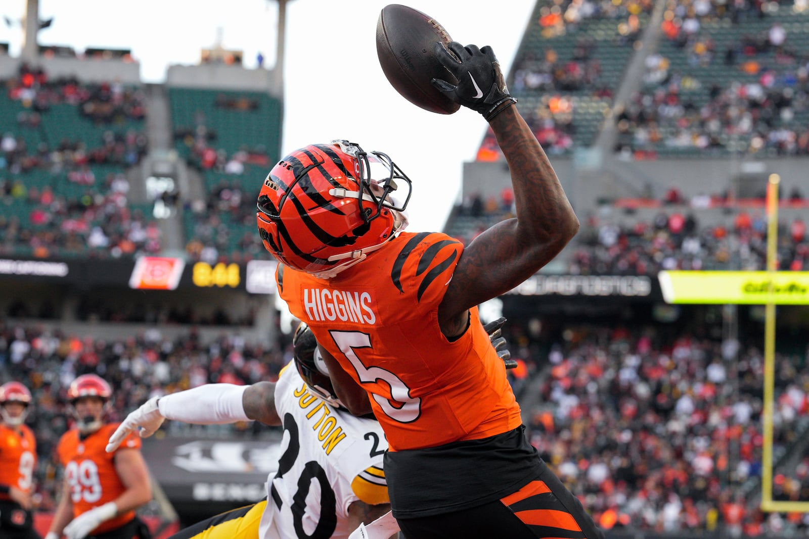 Cincinnati Bengals wide receiver Tee Higgins (5) is unable to catch a pass in the end zone while defended by Pittsburgh Steelers cornerback Cameron Sutton (20) during the second half of an NFL football game Sunday, Dec. 1, 2024, in Cincinnati. (AP Photo/Jeff Dean)