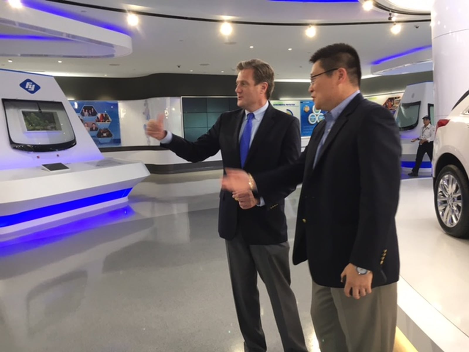 U.S. Rep Mike Turner, R-Dayton, left, with Jeff Liu, president of Fuyao Glass America, as Turner visited Fuyao’s Moraine plant Thursday. THOMAS GNAU/STAFF