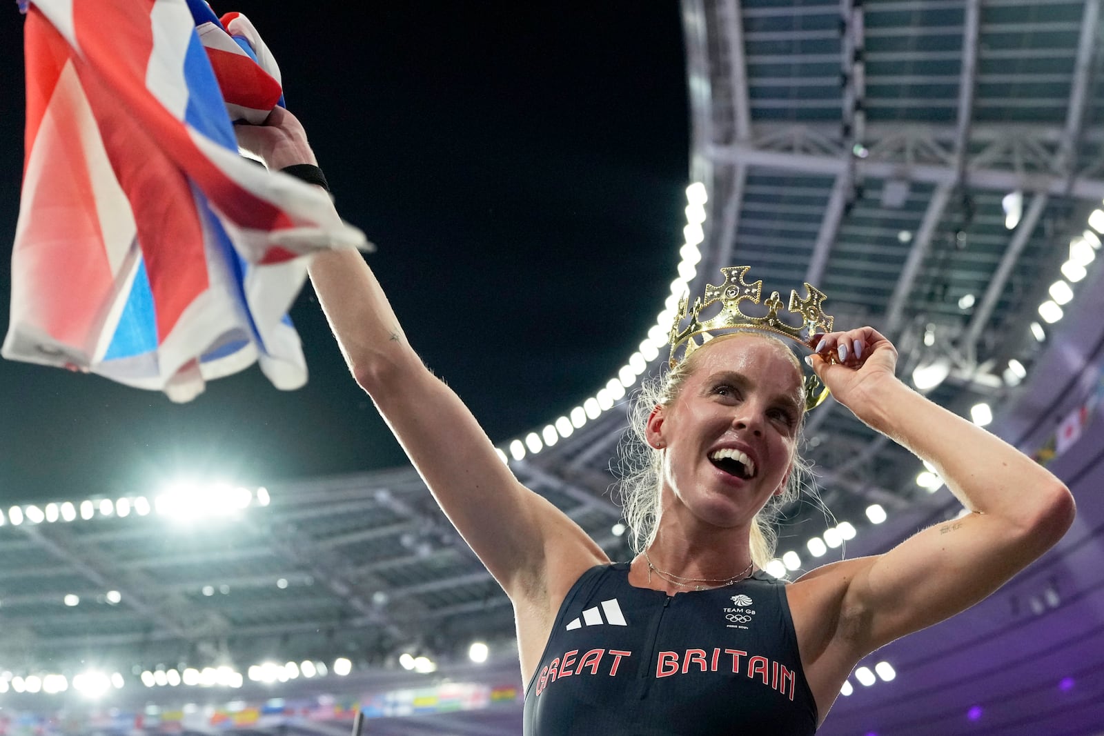 FILE - Keely Hodgkinson, of Britain, celebrates after winning the gold medal in the women's 800 meters final at the 2024 Summer Olympics, Monday, Aug. 5, 2024, in Saint-Denis, France. (AP Photo/Ashley Landis, File)