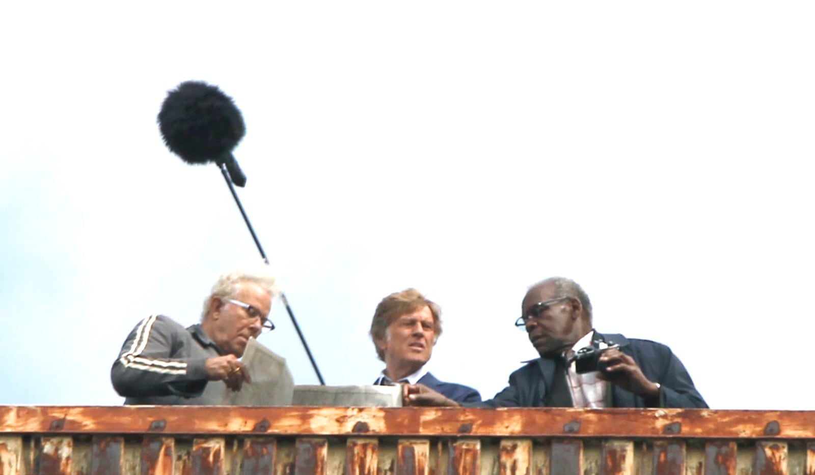 Scenes for the movie, "'Old Man and the Gun," were filmed in downtown Dayton Monday. The movie stars Robert Redford (center) and Danny Glover (right) as well as Casey Affleck and Sissy Spacek. Filming will continue in multiple locations Tuesday including the historic Liberty Savings Bank building on West Second Street.   LISA POWELL / STAFF