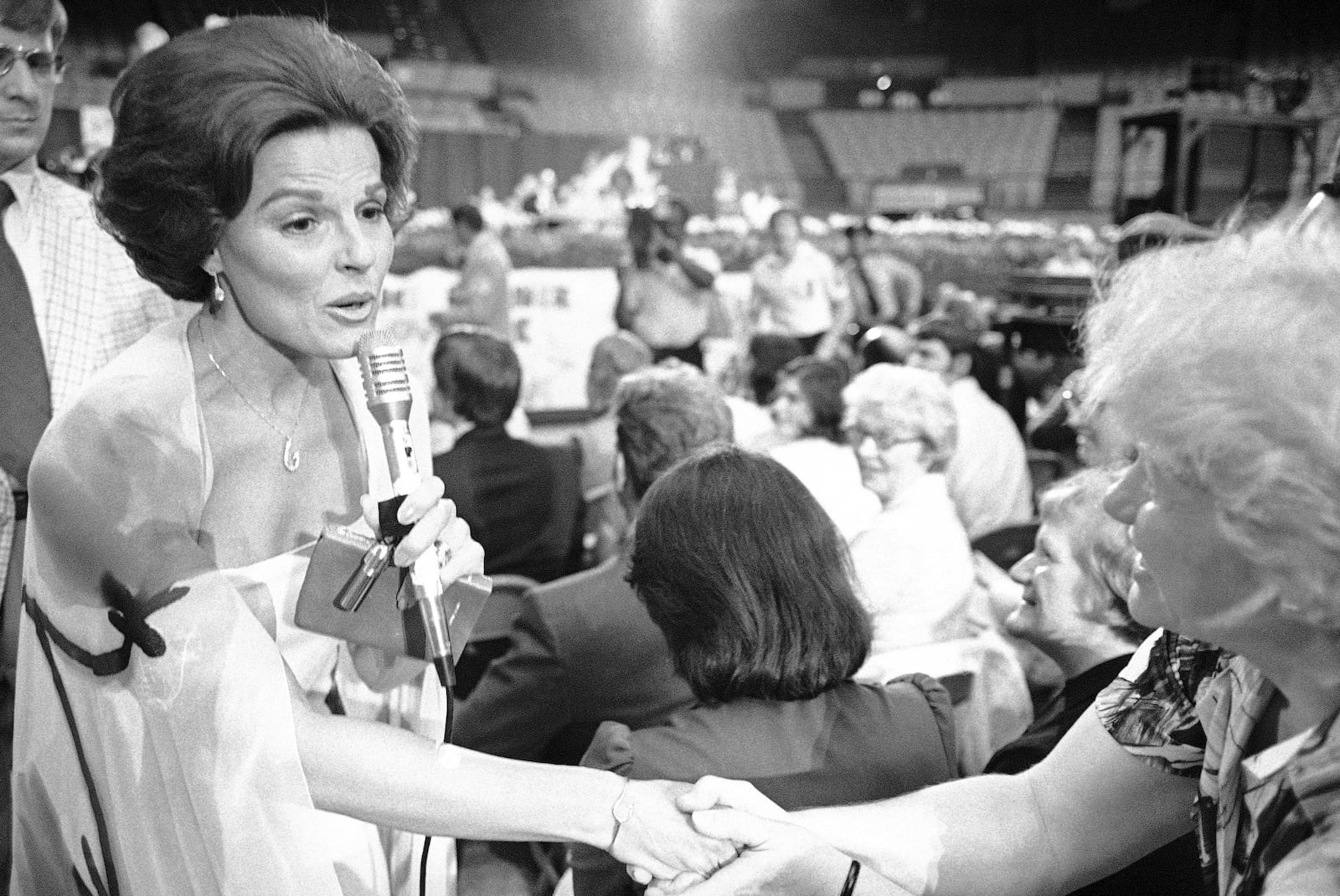 FILE - Anita Bryant shakes the hand of a member of the audience at the Civic Arena in Pittsburgh on May 22, 1978. (AP Photo, File)