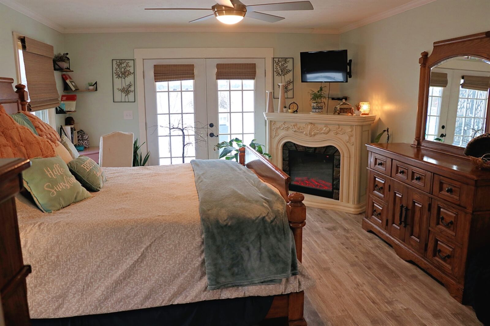 The primary bedroom has French doors that open to the backyard balcony deck. CONTRIBUTED BY KATHY TYLER