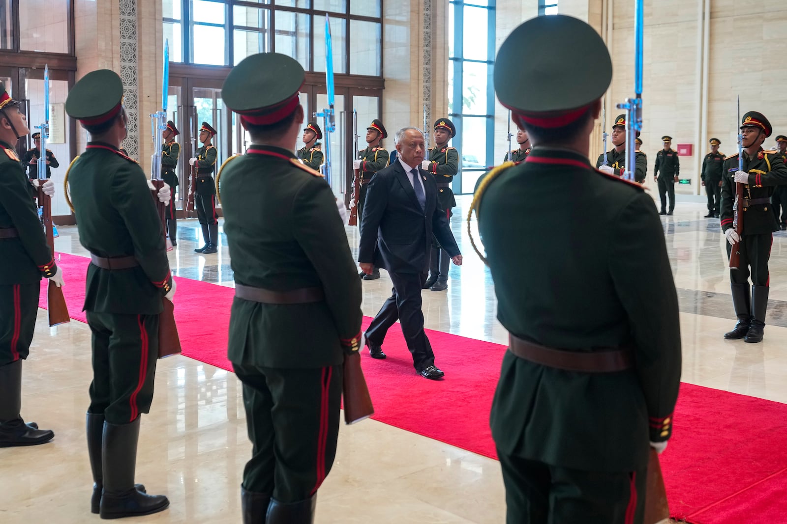 Brunei's Defense Minister II Halbi bin Haji Mohd Yussof, center, arrives to attend the Association of Southeast Asian Nations (ASEAN) defense ministers' meeting in Vientiane, Laos, Wednesday, Nov. 20, 2024. (AP Photo/Anupam Nath)