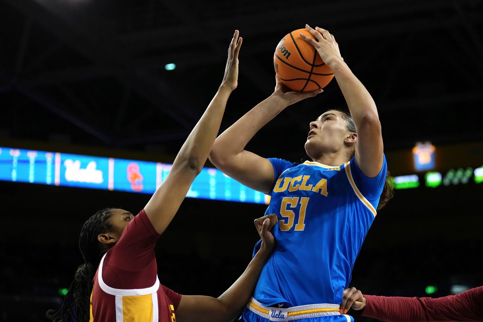 UCLA center Lauren Betts, right, shoots as Southern California center Rayah Marshall defends during the first half of an NCAA college basketball game Saturday, March 1, 2025, in Los Angeles. (AP Photo/Mark J. Terrill)