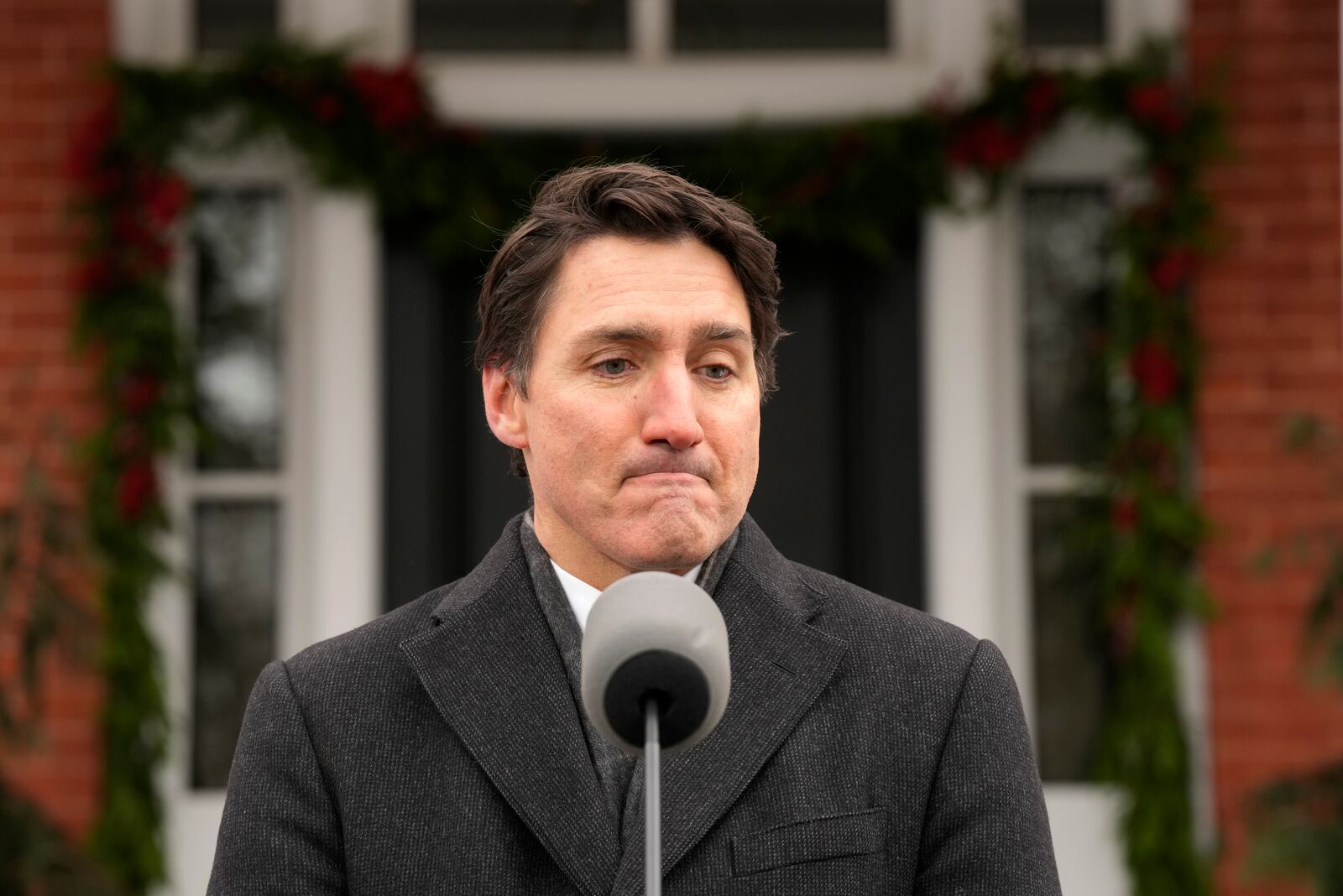 Canada Prime Minister Justin Trudeau makes an announcement outside Rideau Cottage in Ottawa on Monday, Jan. 6, 2025. (Adrian Wyld/The Canadian Press via AP)