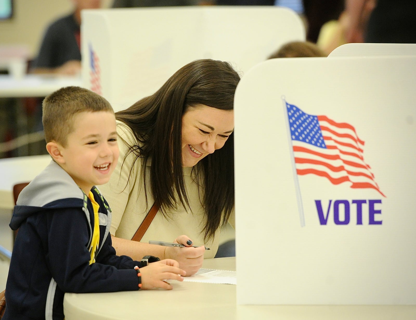 Jenna Kreitzer votes Tuesday, November 7, 2023 with her 5 year-old son Miles, at the St. John the Baptist Catholic Church in Tipp City. MARSHALL GORBY \STAFF