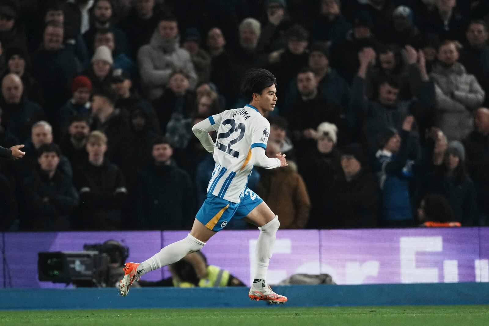 Brighton's Kaoru Mitoma runs after he scored during the English Premier League soccer match between Brighton and Chelsea in Brighton, England, Friday, Feb. 14, 2025. (AP Photo/Dave Shopland)