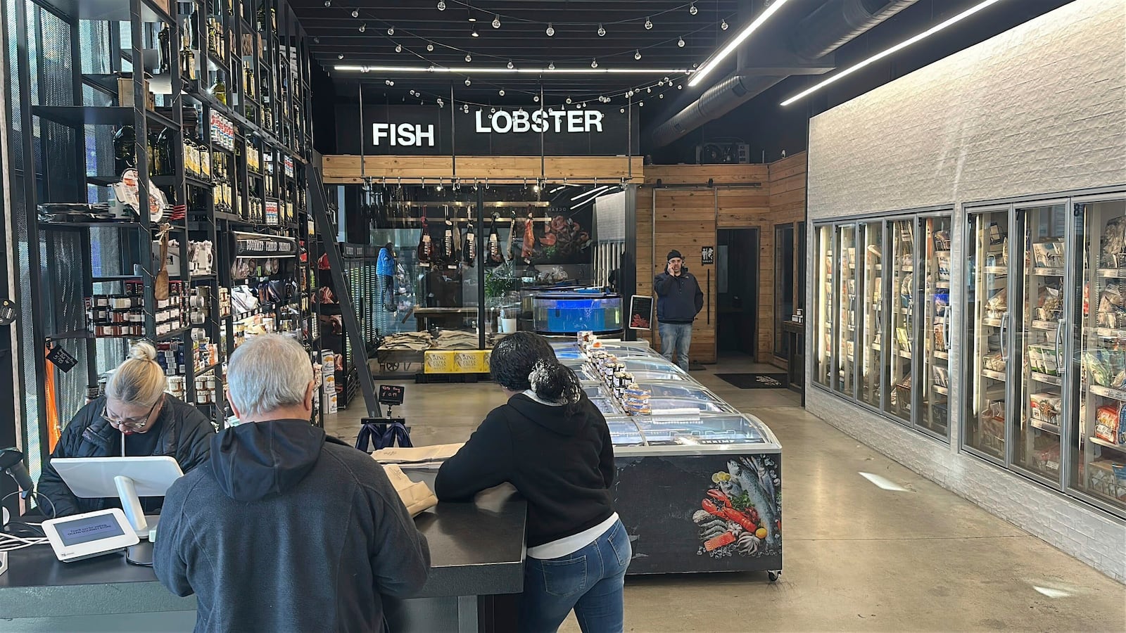 Shoppers check out at an Ocean Seafood Depot store Friday, Jan. 24, 2025, in Newark, N.J. (AP Photo/Ted Shaffrey)