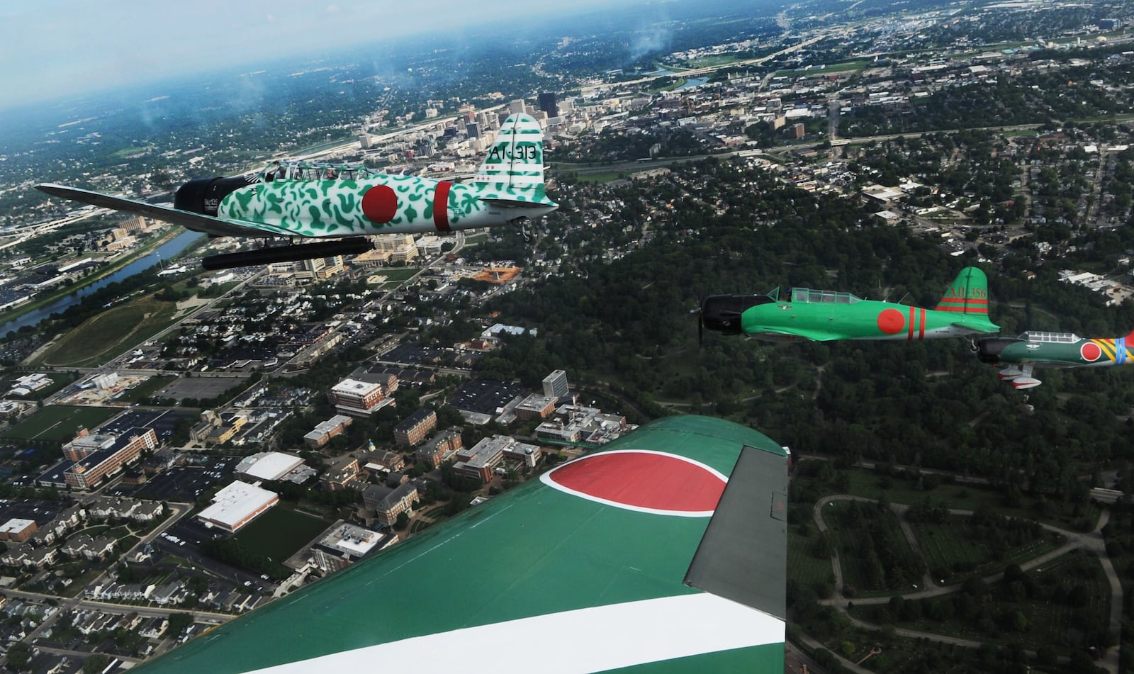 Dayton Daily News photojournalist Marshall Gorby flies with Tora!, Tora! Tora! Air Show over Dayton Friday July, 29, 2022. The show will be featured at the Dayton Air Show this weekend.. MARSHALL GORBY\STAFF