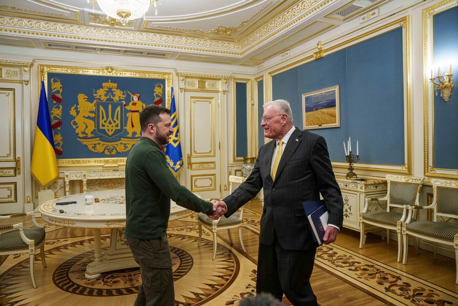 U.S. Special Envoy for Ukraine and Russia Keith Kellogg, right, and Ukraine's President Volodymyr Zelenskyy shake hands during their meeting in Kyiv, Ukraine, Feb. 20, 2025. (AP Photo/Evgeniy Maloletka)