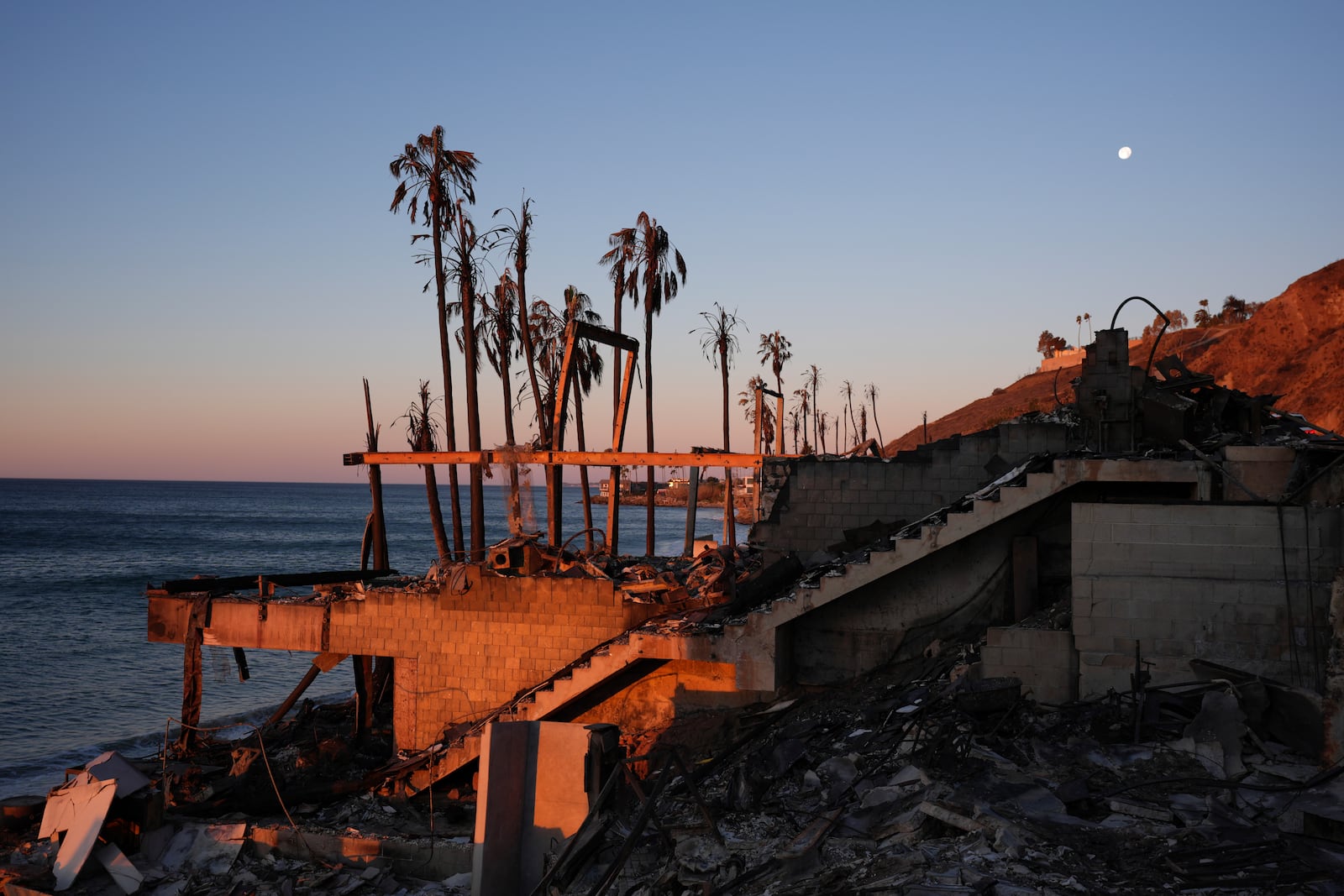 A beach front home destroyed by the Palisades Fire is seen in Malibu, Calif., Wednesday, Jan. 15, 2025. (AP Photo/Jae C. Hong)