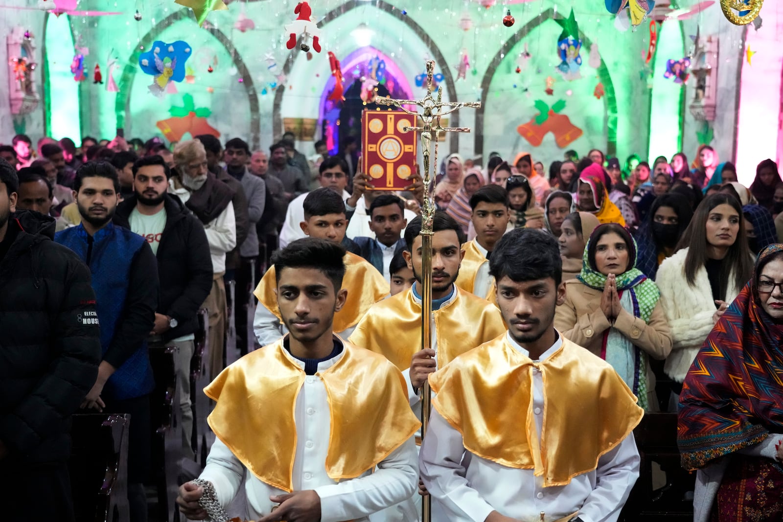 Pakistani Christians attend midnight Christmas Mass at St. Anthony's church in Lahore, Pakistan, Wednesday, Dec. 25, 2024. (AP Photo/K.M. Chaudary)