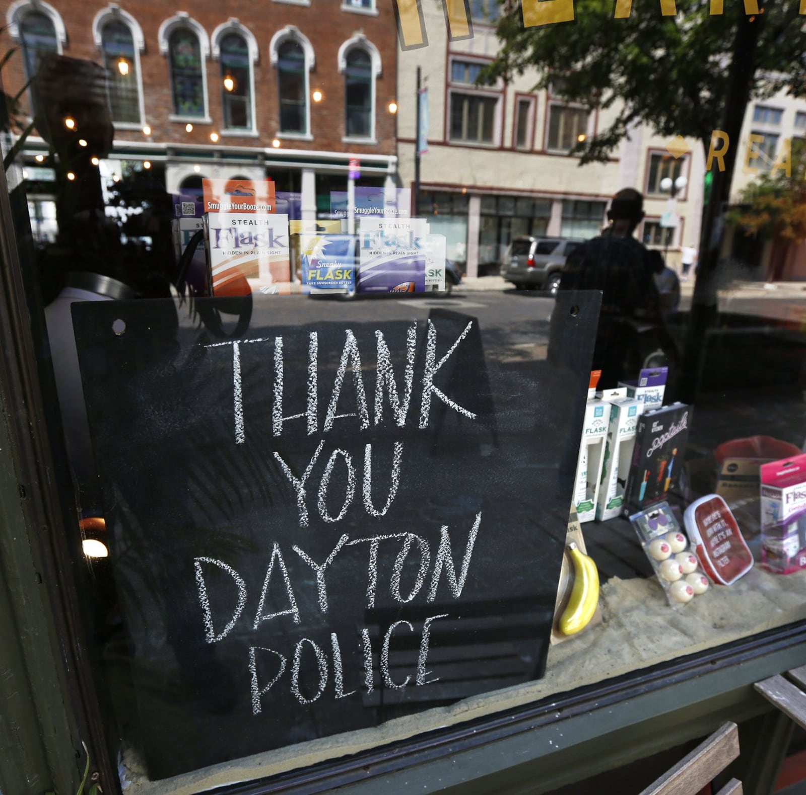 Signs supporting the Dayton Police Department can be found throughout the Oregon District, including this window sign at Feathers. TY GREENLEES / STAFF Signs supporting the Dayton Police Department can be found throughout the Oregon District, including this chalkboard sign at Heart Mercantile. TY GREENLEES / STAFF