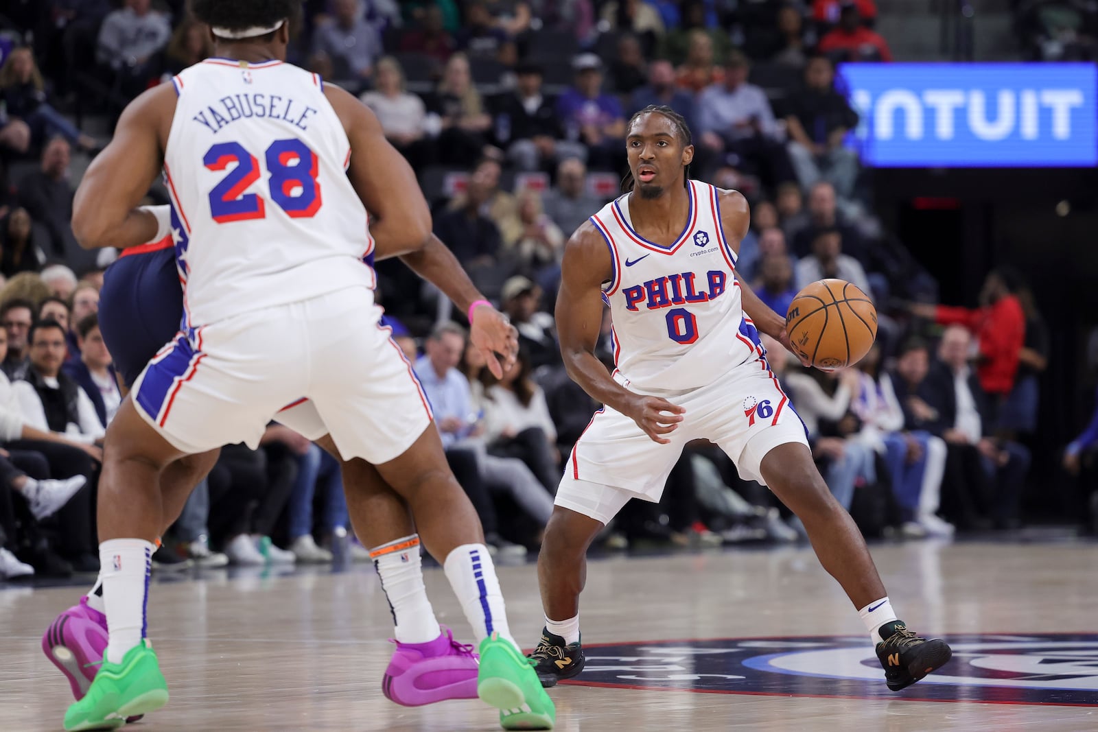 Philadelphia 76ers guard Tyrese Maxey, right, drives past forward Guerschon Yabusele during the first half of an NBA basketball game against the Los Angeles Clippers, Wednesday, Nov. 6, 2024, in Inglewood, Calif. (AP Photo/Ryan Sun)