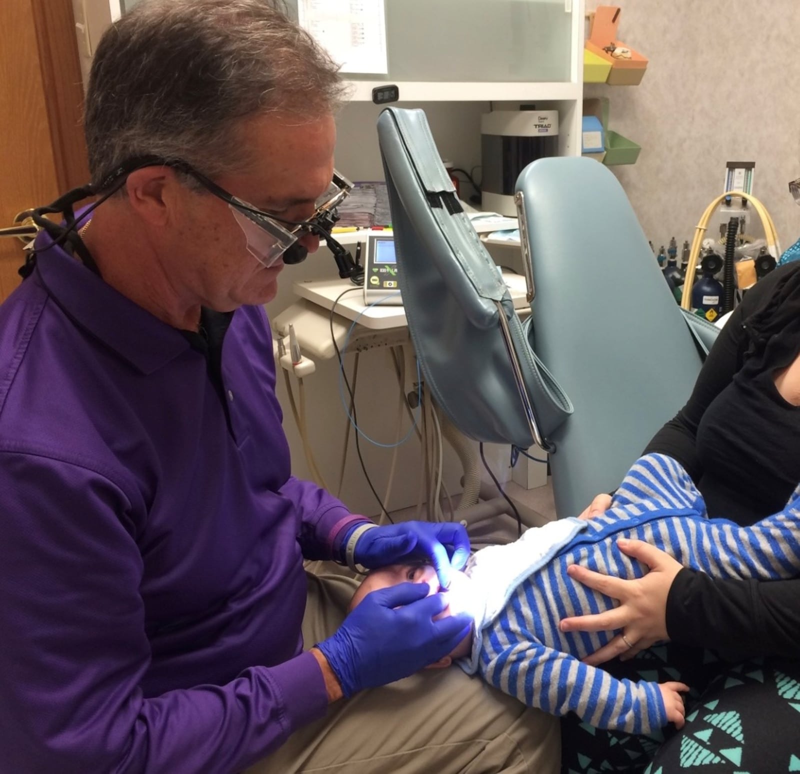 --  Dr. Greg Notestine examining a child for tongue tie treatment. The Far Hills dentist is known around the world  for his tongue tie treatment. CONTRIBUTED