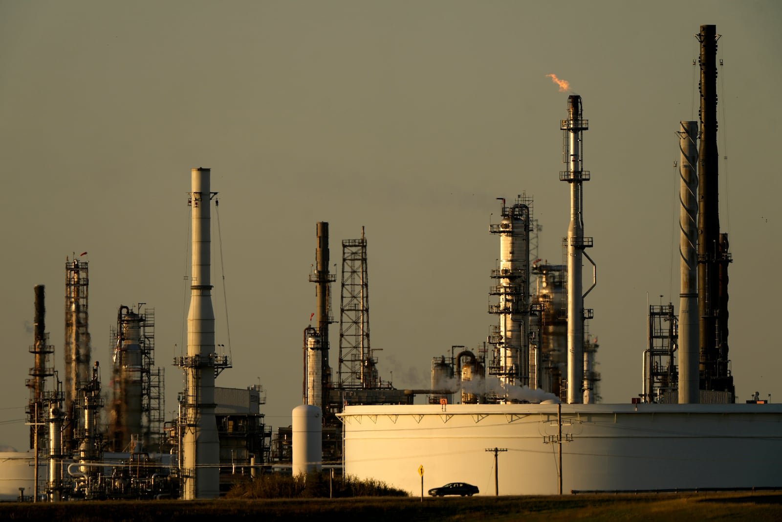 A motorist drives past the CHS oil refinery Saturday, Sept. 28, 2024, in McPherson, Kan. (AP Photo/Charlie Riedel)