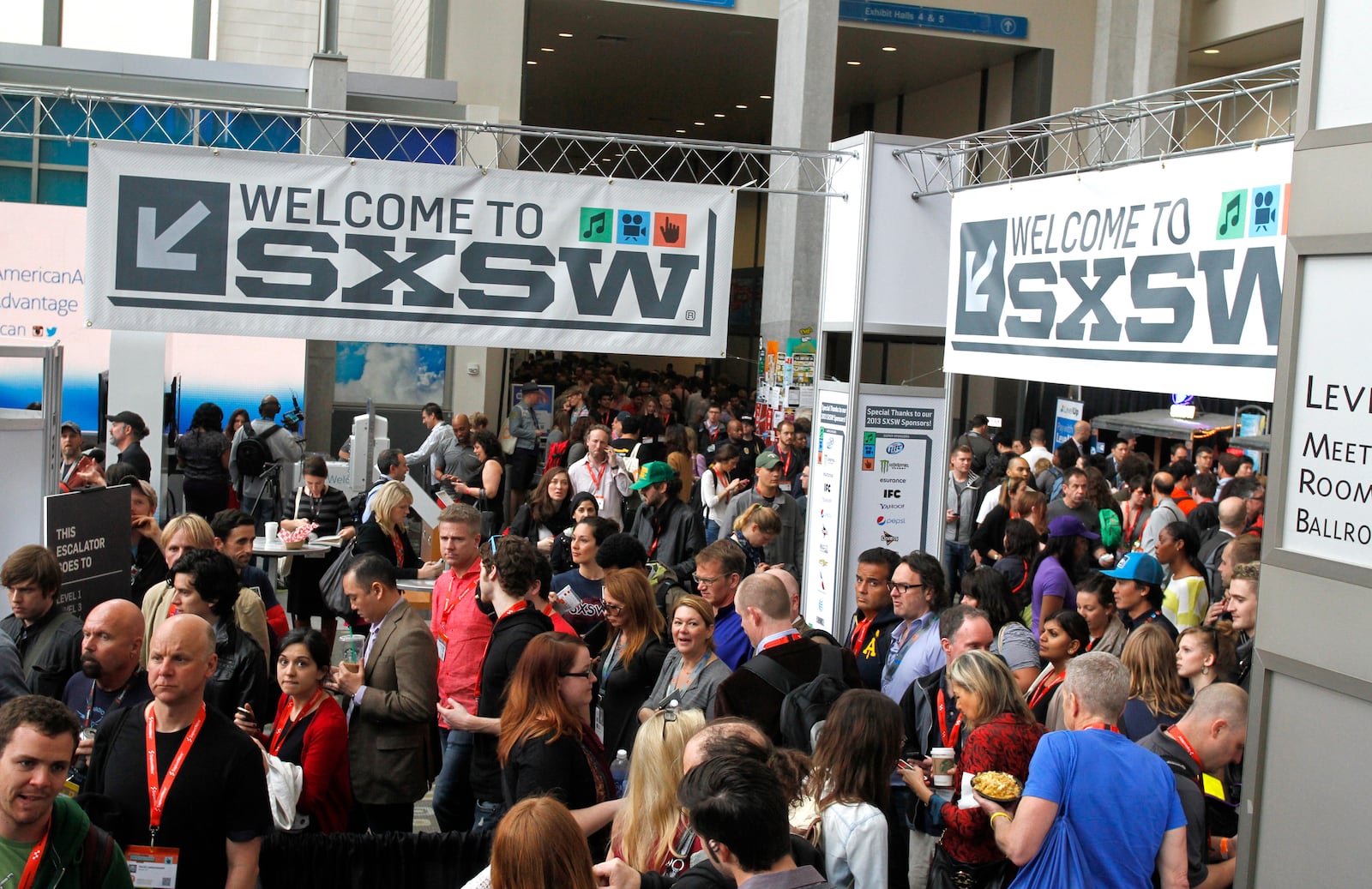 FILE - SXSW Interactive and Film Festival attendees crowd the Austin Convention Center on March 9, 2013, in Austin, Texas. (AP Photo/Jack Plunkett, File)