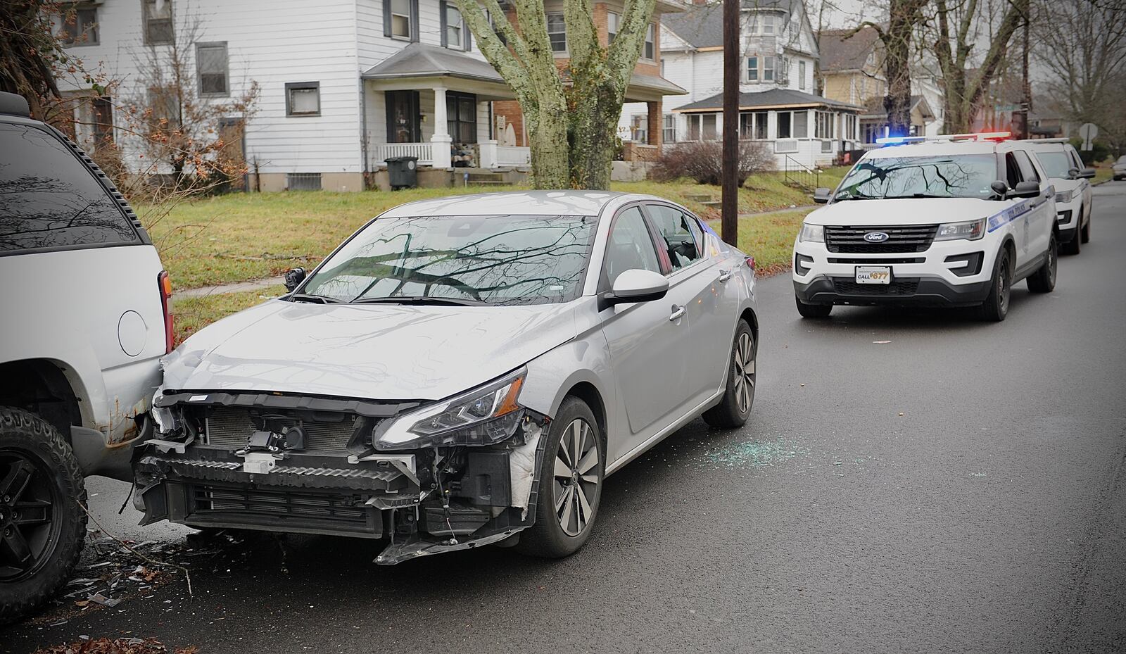 Dayton police found a silver car with multiple bullets holes shortly after 911 dispatchers received reports of people shooting at each other from vehicles on Wednesday, Dec. 29, 2021. MARSHALL GORBY / STAFF