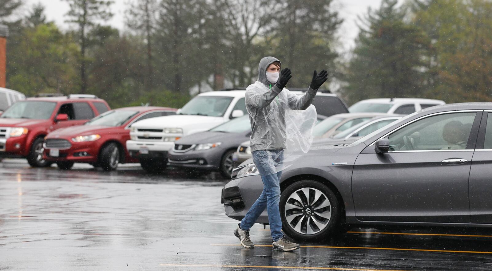 Members of First Grace Church in Butler Twp. met in the church parking lot but kept in their cars for the fourth Sunday in a row. CHRIS STEWART / STAFF