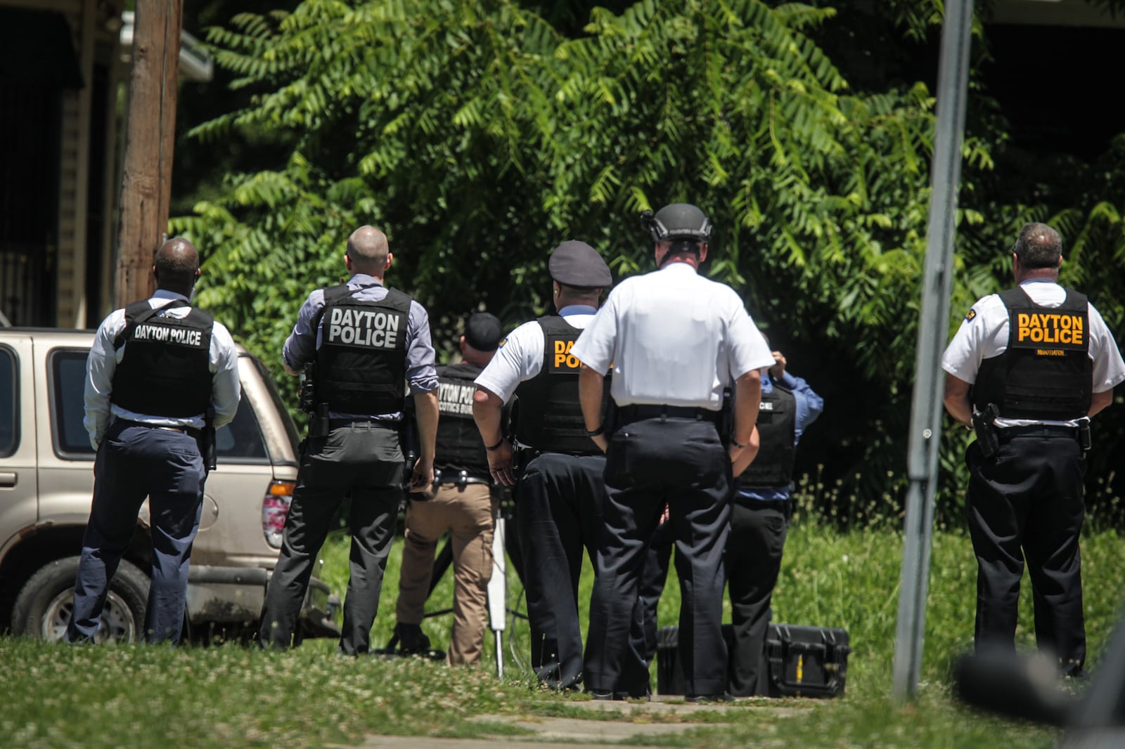 Dayton police were outside a home near the corner of North Euclid and Superior avenues where a naked man was the roof Tuesday, June 22, 2021. JIM NOELKER / STAFF