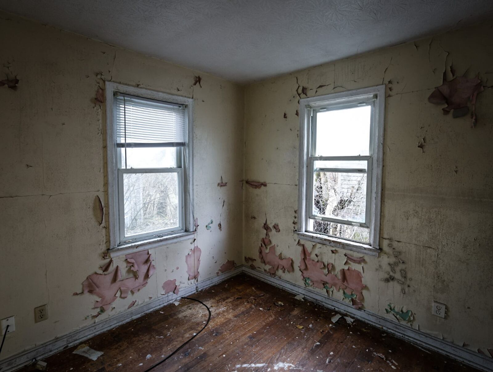 This abandoned home on Mia Avenue in the Residence Park neighborhood is on the city of Dayton's nuisance list. JIM NOELKER/STAFF