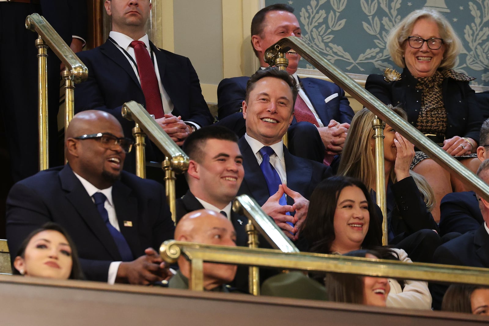 Elon Musk, center, listens as President Donald Trump addresses a joint session of Congress at the Capitol in Washington, Tuesday, March 4, 2025. (Win McNamee/Pool Photo via AP)