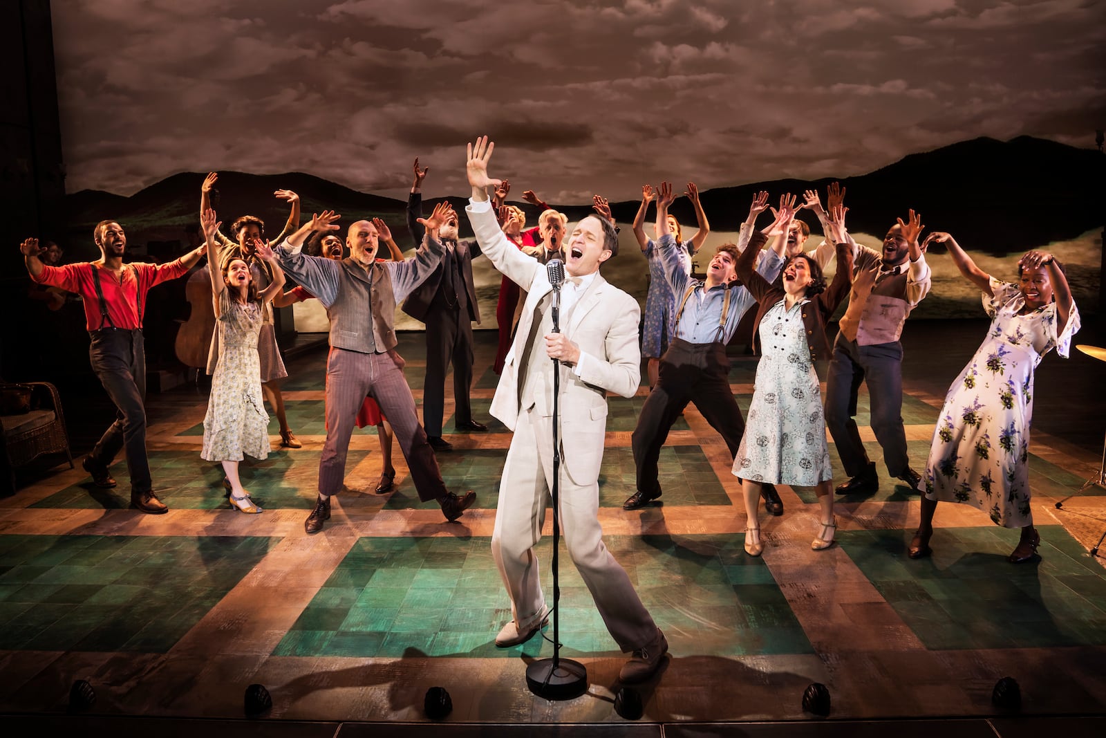 Todd Almond performs with the cast in "Girl From the North Country" in New York. The Depression-era drama set to the songs of Bob Dylan, will re-open on Broadway this spring, a little more than three months after going on hiatus due to virus concerns. (Matthew Murphy/Rubenstein via AP)