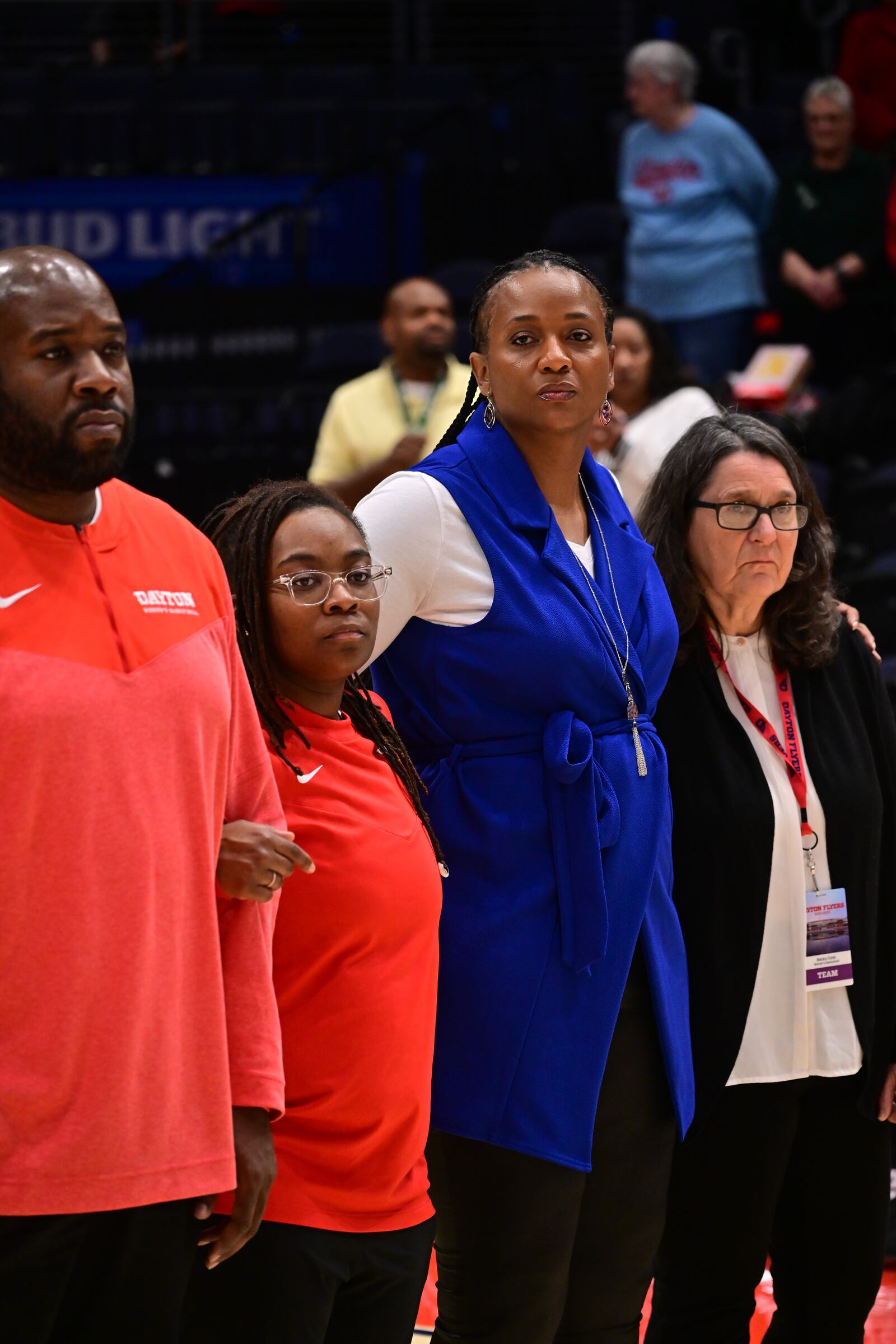 Dayton head coach Tamika Williams-Jeter (second from right) along with (from left) video coordinator Trendale Perkins, director of operations Christina Bacon and sports psychologist Dr. Becky Cook before Wednesday night's game vs. Ohio. Erik Schelkun/UD Athletics