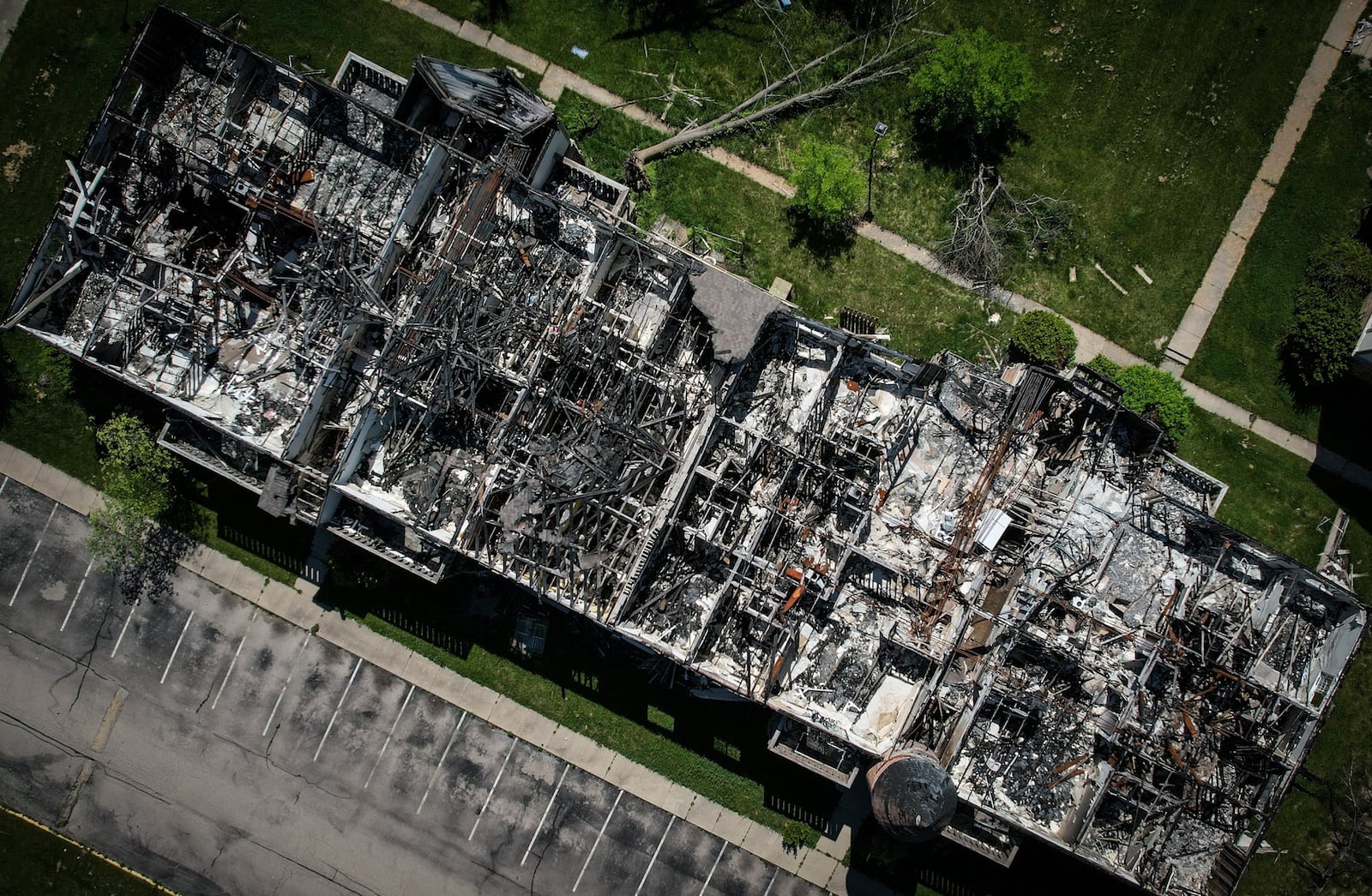 This is an aerial photo of a burned-out apartment building at the Woodland Hills complex in Trotwood in May 2022. The development sits empty three years after the 2019 Memorial Day tornadoes ripped through the area. JIM NOELKER/STAFF