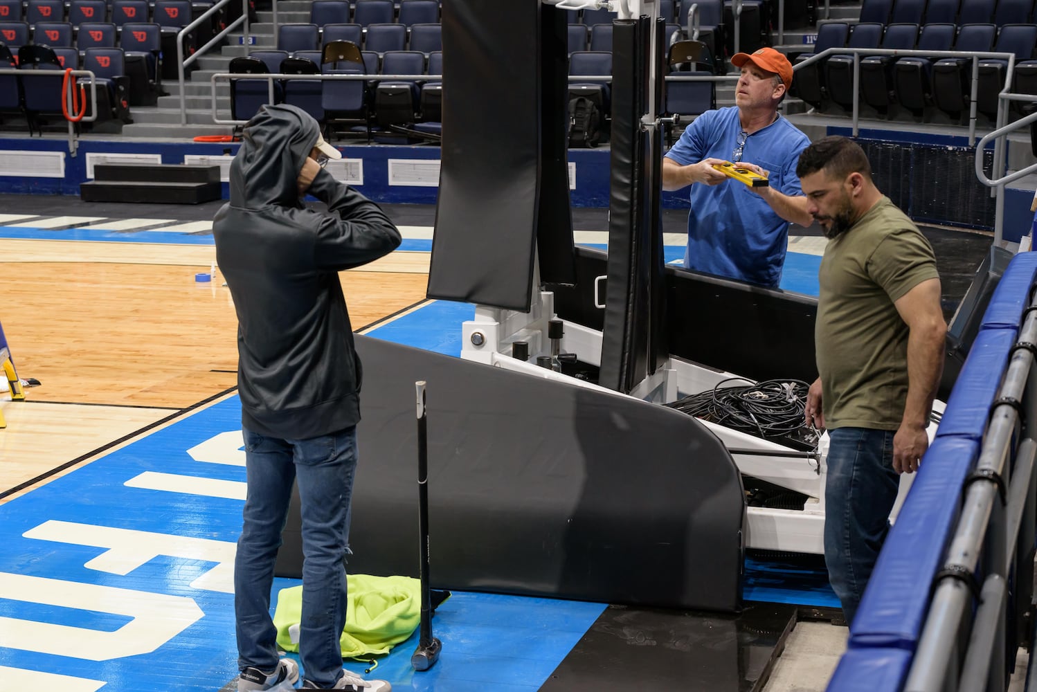 PHOTOS: NCAA First Four basketball court installation at UD Arena