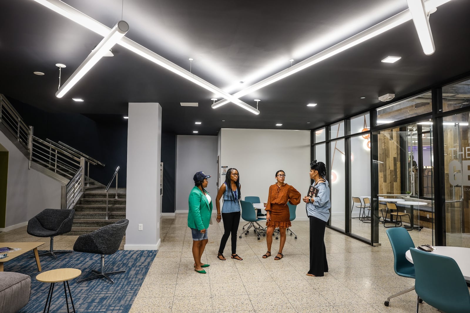 Greater West Dayton Incubator fellows meet with incubator Director Whitney Barkley at The Hub Powered by PNC Bank at the Arcade in downtown Dayton. From left are Jameelah Ricks, Barkley, Taylor Johnson, and Dawn Turner. The Incubator assists entrepreneurs and small businesses. The new Dayton Region Economic Development Strategy prioritizes entrepreneurship and small business and sets equity goals. JIM NOELKER/STAFF