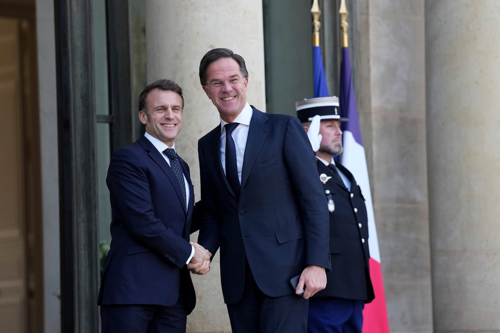 French President Emmanuel Macron, left, greets NATO Secretary General Mark Rutte as he arrives for an informal meeting of leaders from key European Union nations and the United Kingdom at the Elysee Palace in Paris, Monday, Feb. 17, 2025. (AP Photo/Aurelien Morissard)