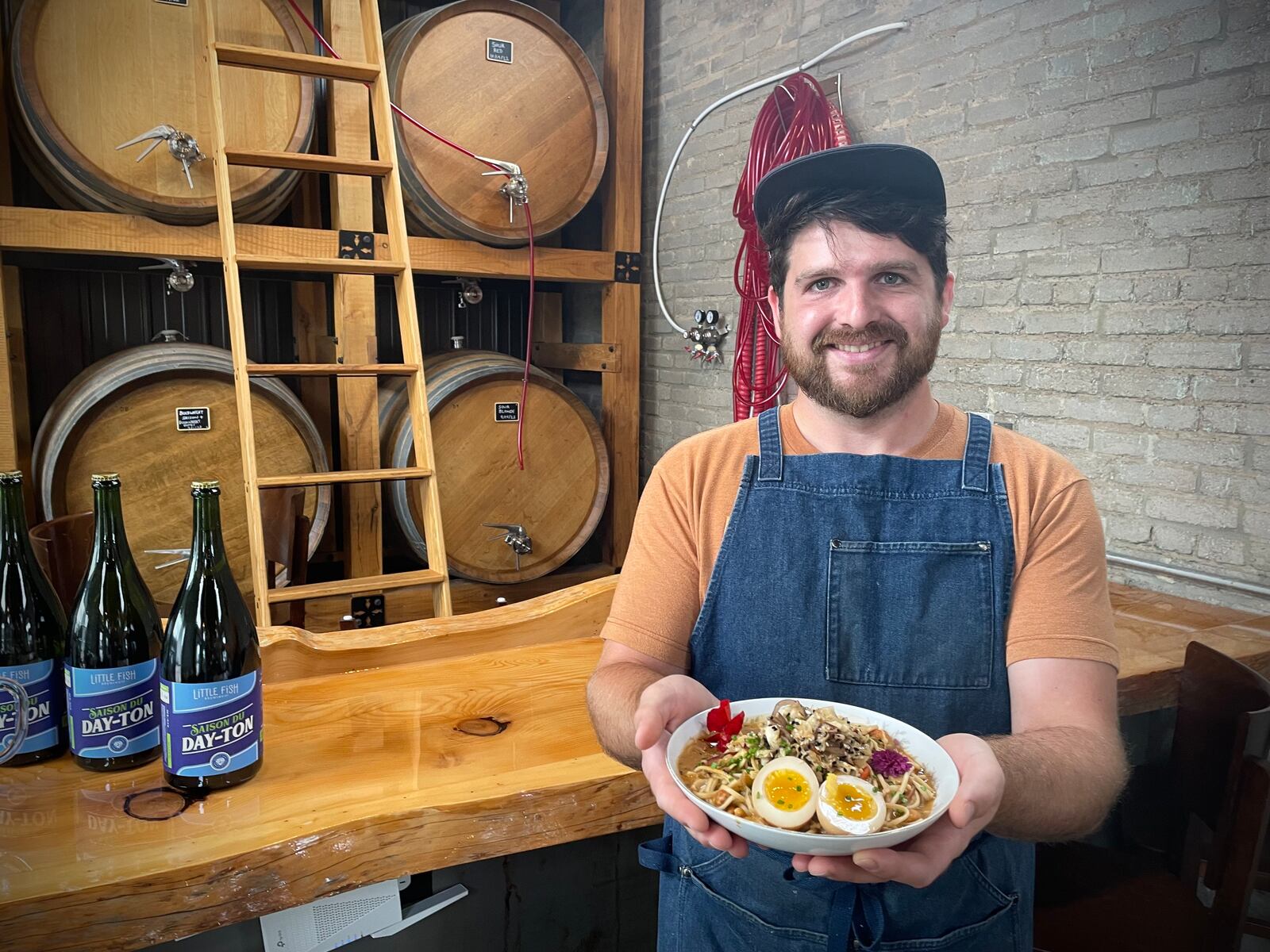 Zach Morgan is the executive chef and general manager of Little Fish Brewing Company in Dayton. NATALIE JONES/STAFF