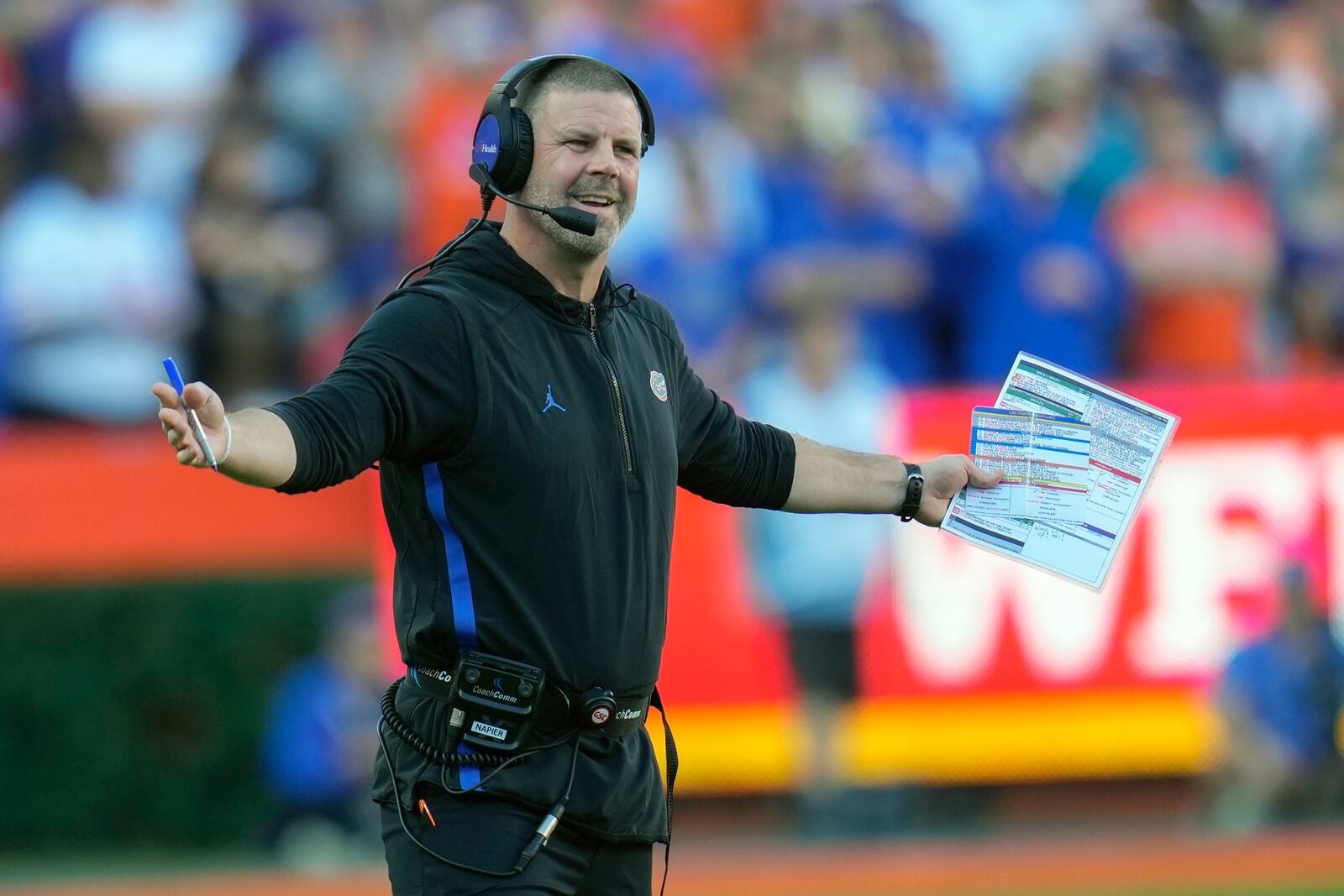 Florida head coach Billy Napier questions a ruling by officials during the first half of an NCAA college football game against LSU, Saturday, Nov. 16, 2024, in Gainesville, Fla. (AP Photo/John Raoux)