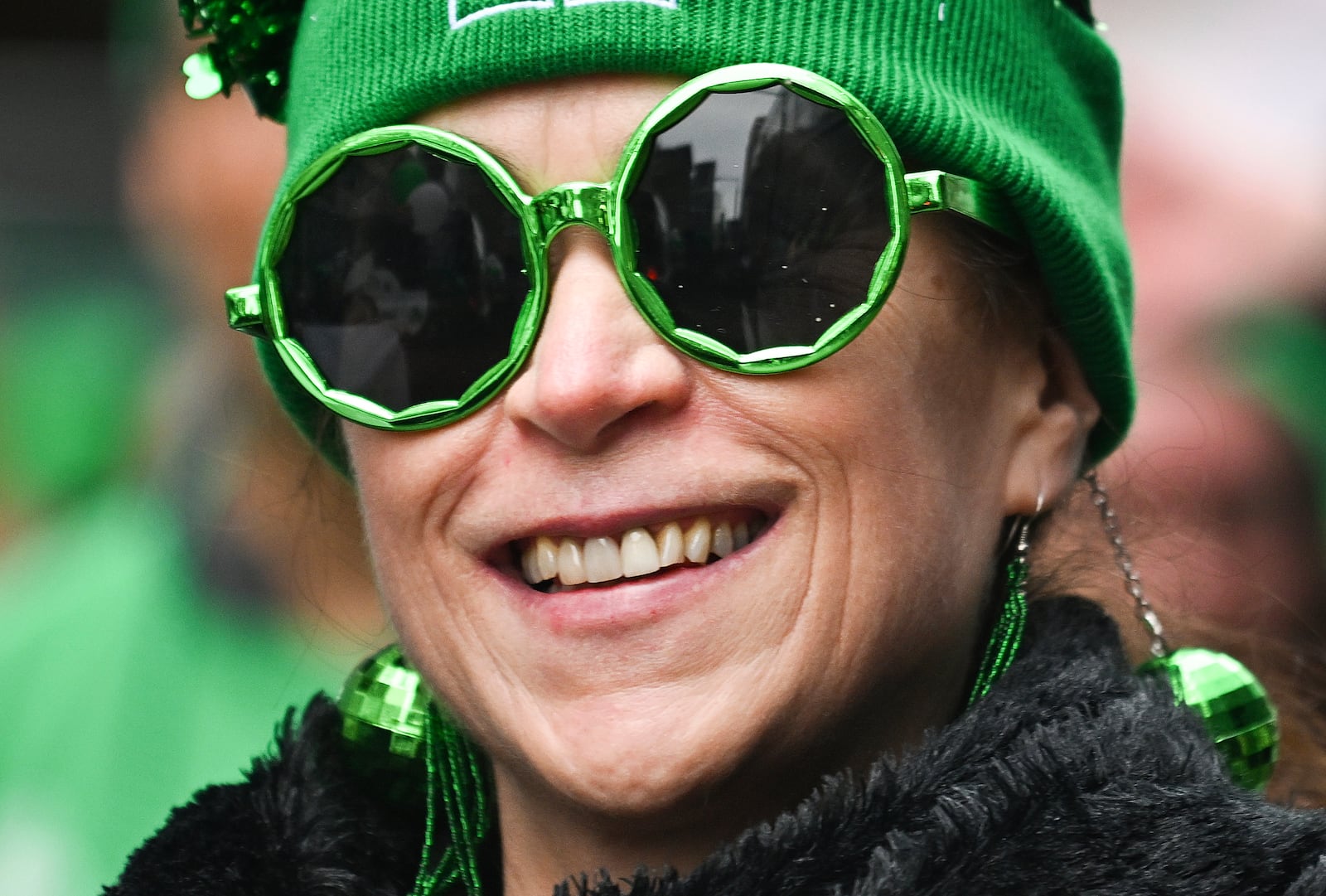 A participant smiles during the annual St. Patrick's Day Parade in Montreal, Sunday, March 16, 2025.(Graham Hughes /The Canadian Press via AP)