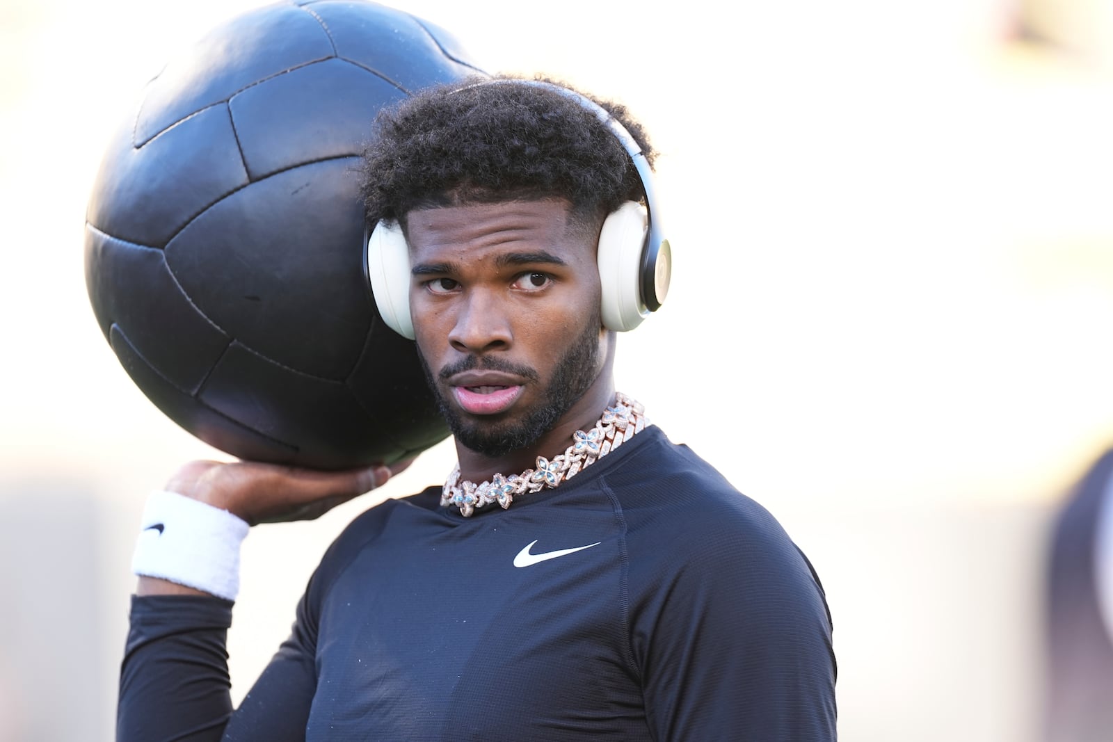 Colorado quarterback Shedeur Sanders warms up before an NCAA college football game against Utah Saturday, Nov. 16, 2024, in Boulder, Colo. (AP Photo/David Zalubowski)