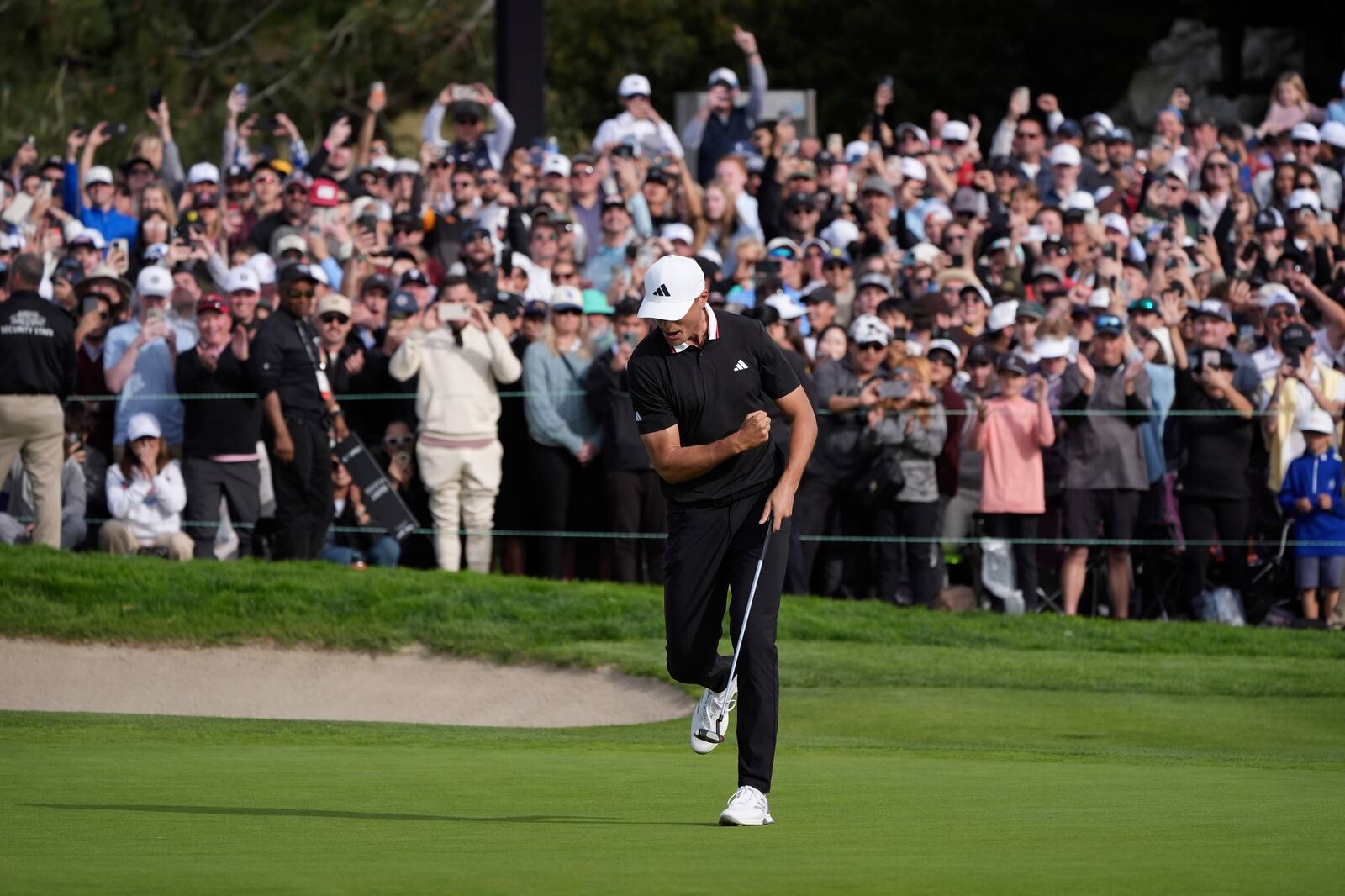 Ludvig Åberg, of Sweden, celebrates after winning the Genesis Invitational golf tournament Sunday, Feb. 16, 2025, in San Diego. (AP Photo/Gregory Bull)