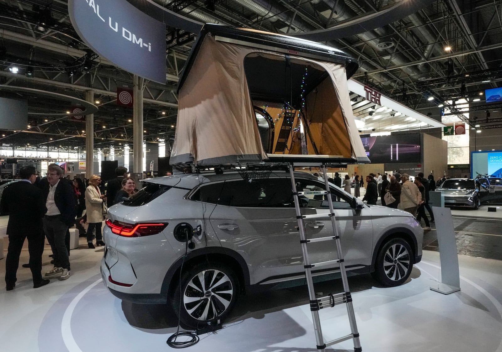 A BYD SEAL U DM-i with a tent on the top is presented at the Paris Auto Show, in Paris, Monday, Oct. 14, 2024. (AP Photo/Michel Euler)