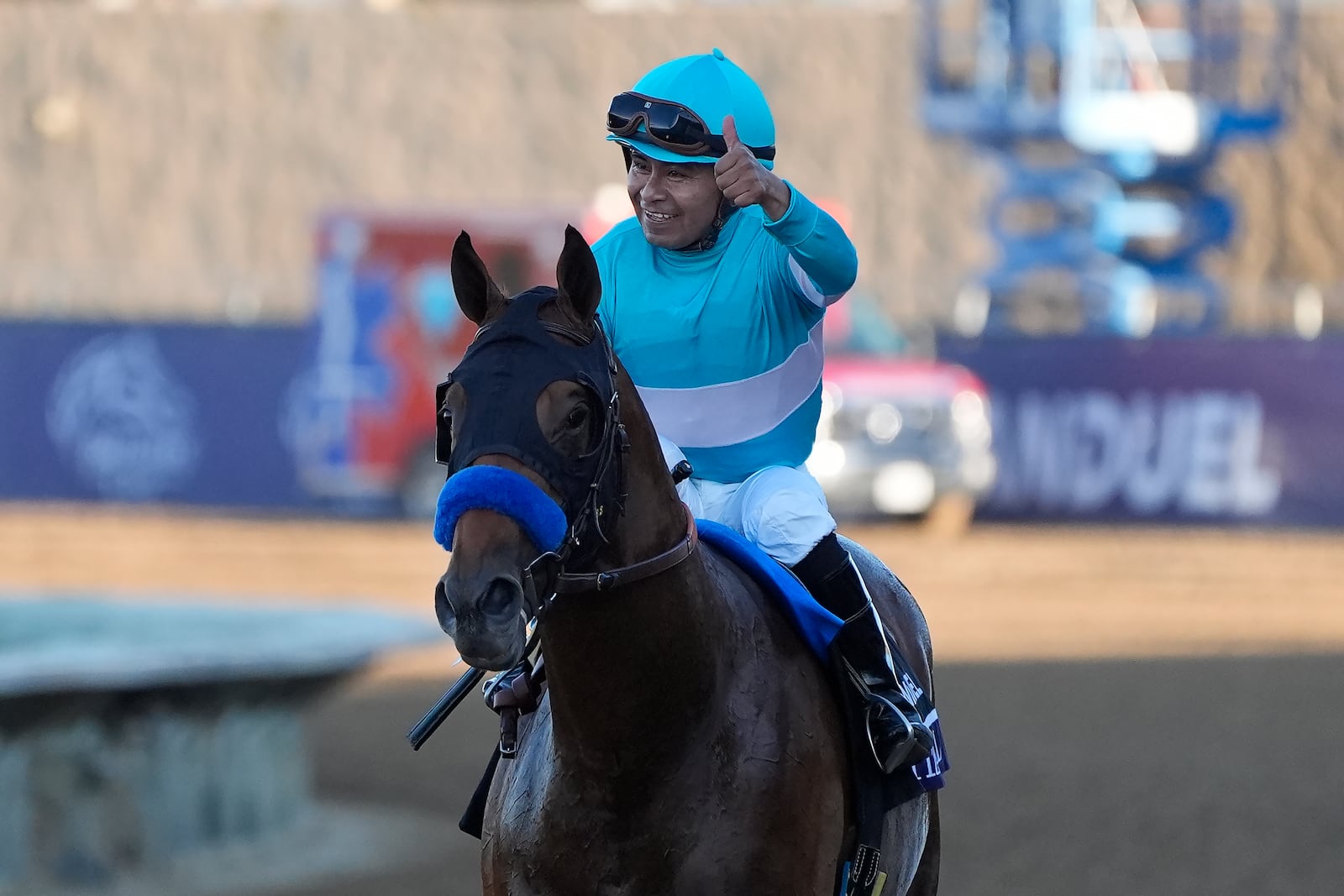 Martin Garcia celebrates after riding Citizen Bull to victory in the Breeders' Cup Juvenile horse race at Santa Anita Park in Del Mar, Calif., Friday, Nov. 1, 2024. (AP Photo/Gregory Bull)