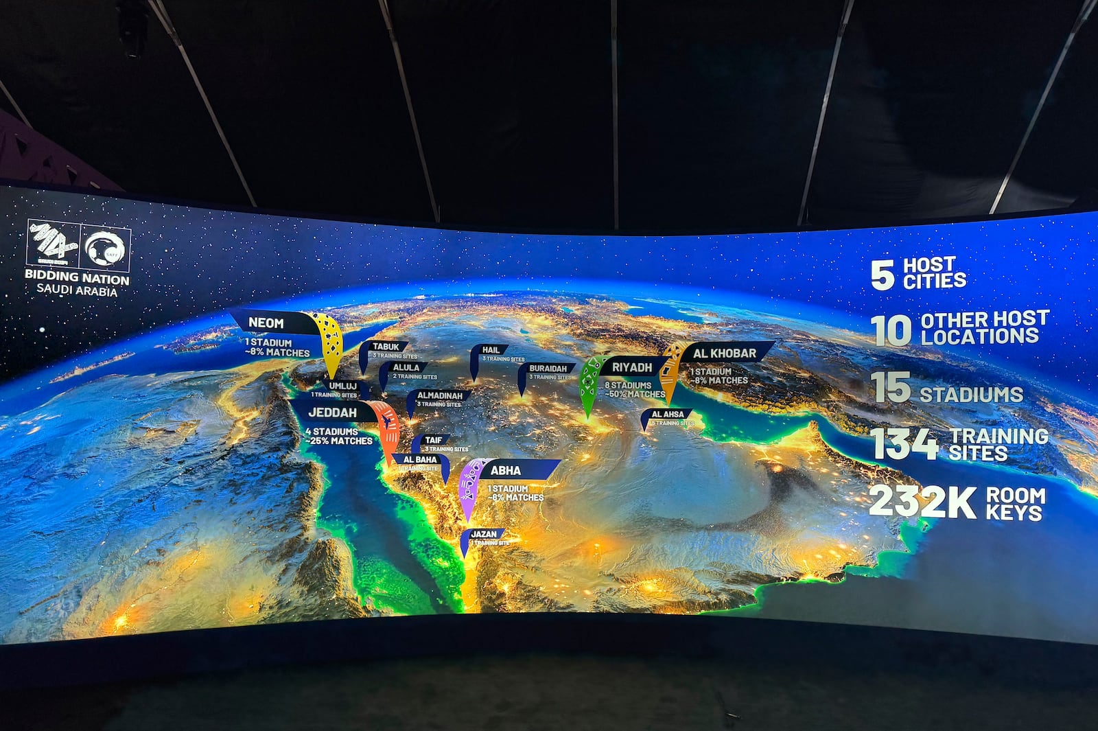 A map at the Saudi Arabia World Cup bid exhibition in Riyadh, Saudi Arabia, Wednesday Dec. 11, 2024, showing the proposed host cities and venues for the 2034 World Cup. (AP Photo/Baraa Anwer)