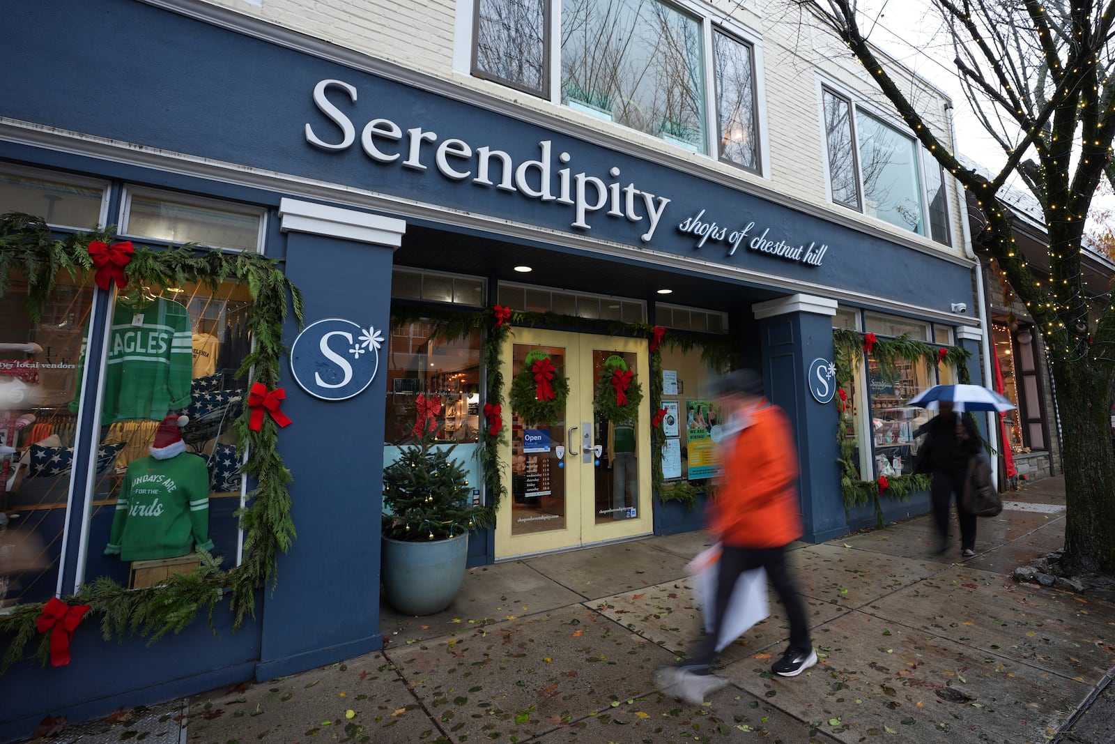 People walk past Serendipity, Wednesday, Dec. 11, 2024, in Philadelphia. (AP Photo/Matt Slocum)