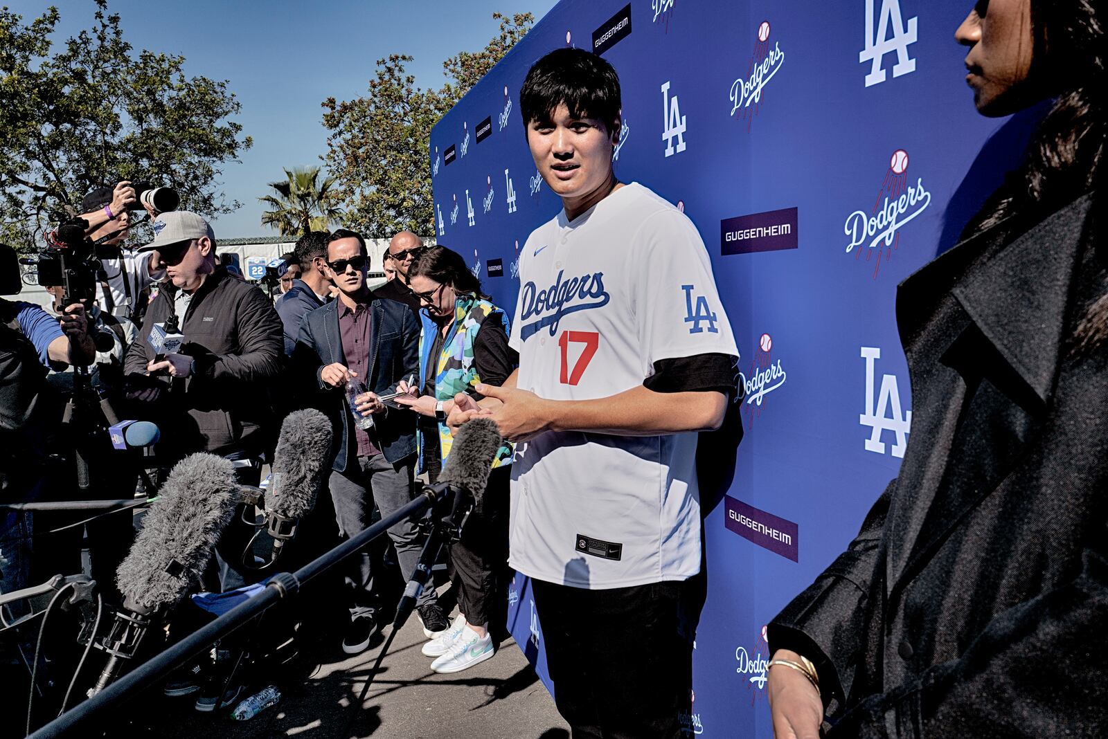 Los Angeles Dodgers' Shohei Ohtani talks to the media during a baseball interview during DodgerFest at Dodger Stadium, Saturday, Feb. 1, 2025, in Los Angeles. (AP Photo/Richard Vogel)